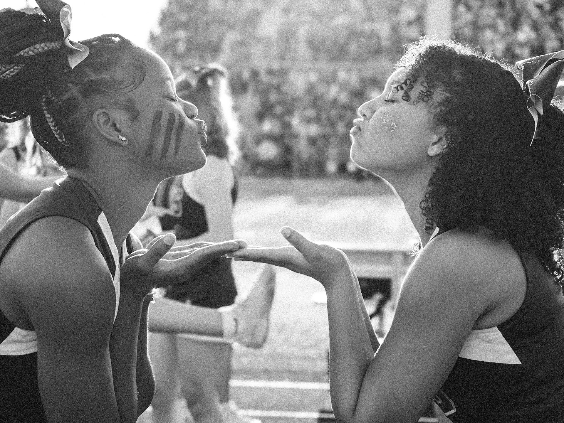 Caught in a lighthearted moment, AhNya Pittman and Tristan Bisson blow kisses and share some laughs, while Caledonia and Hudsonville fight to win. (Photo by Lillian Jackson)