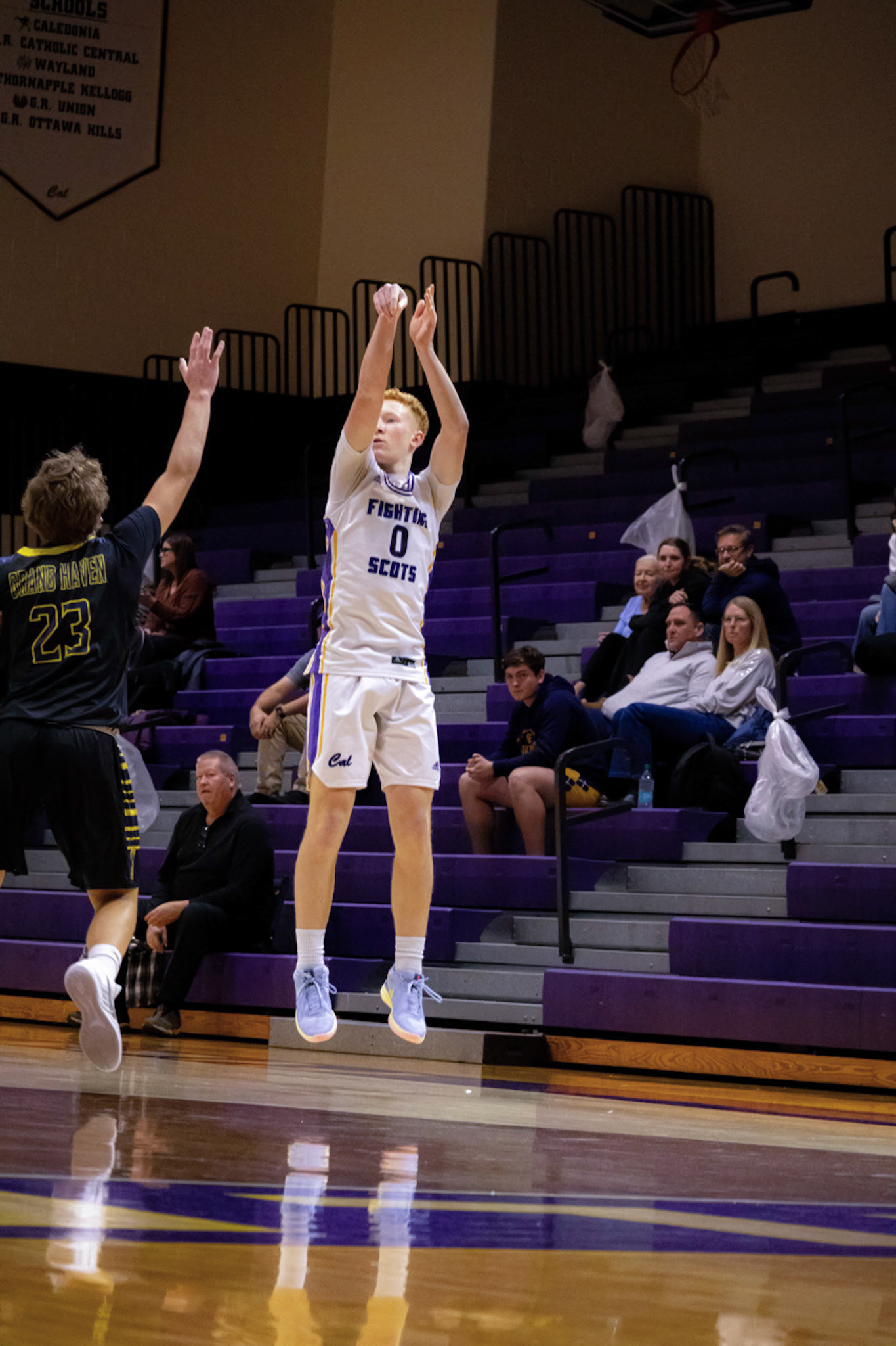 Owen Bloemers drains a no-dip three over a defender as the opposing coach shouts, “Step up—that’s their shooter!” (Photo by Jeremiah Pittman)