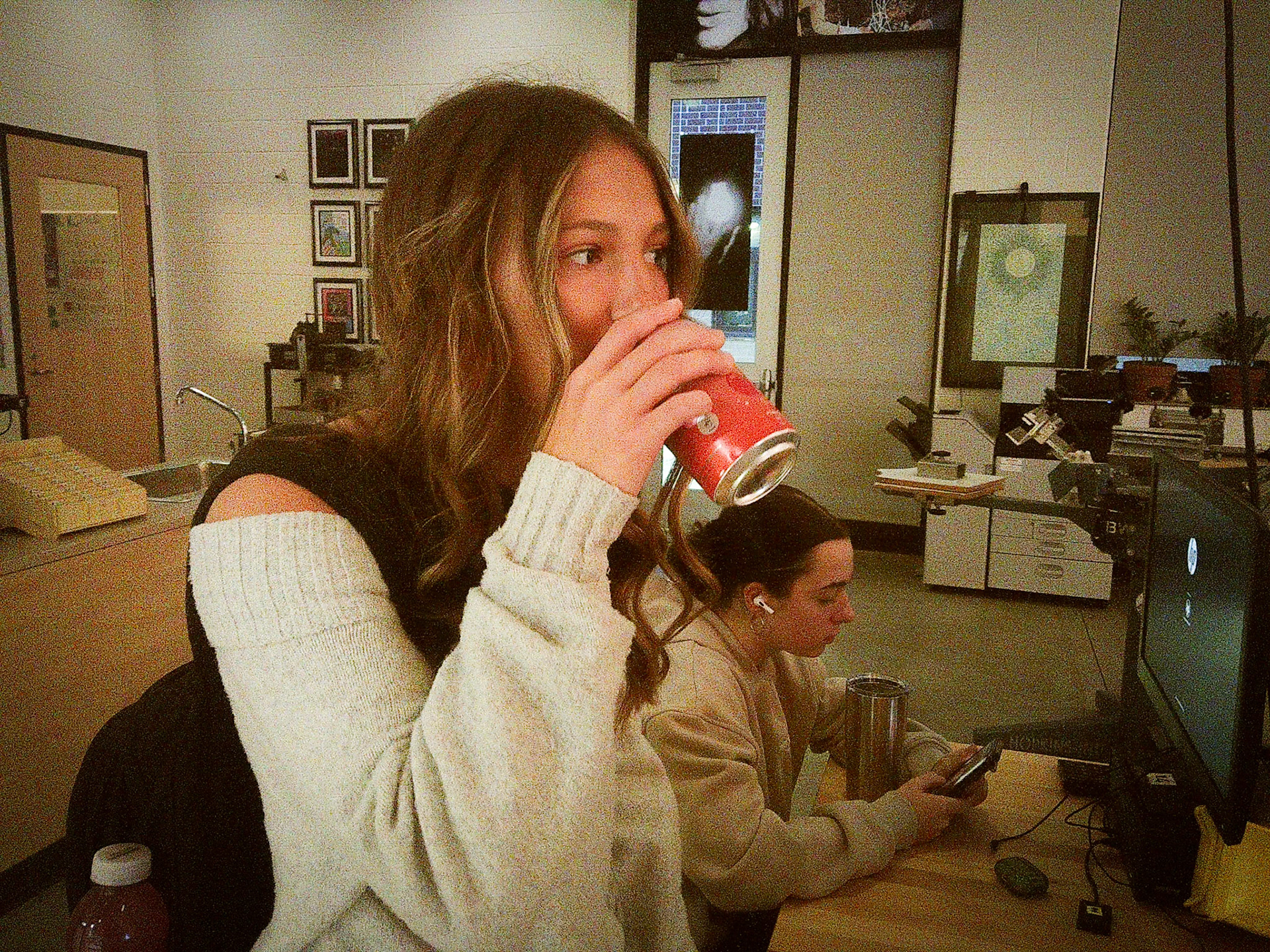 Senior Baylee DeVries sneaks a sip  of her friend Tana Coates energy drink before class.(Tana Coates)