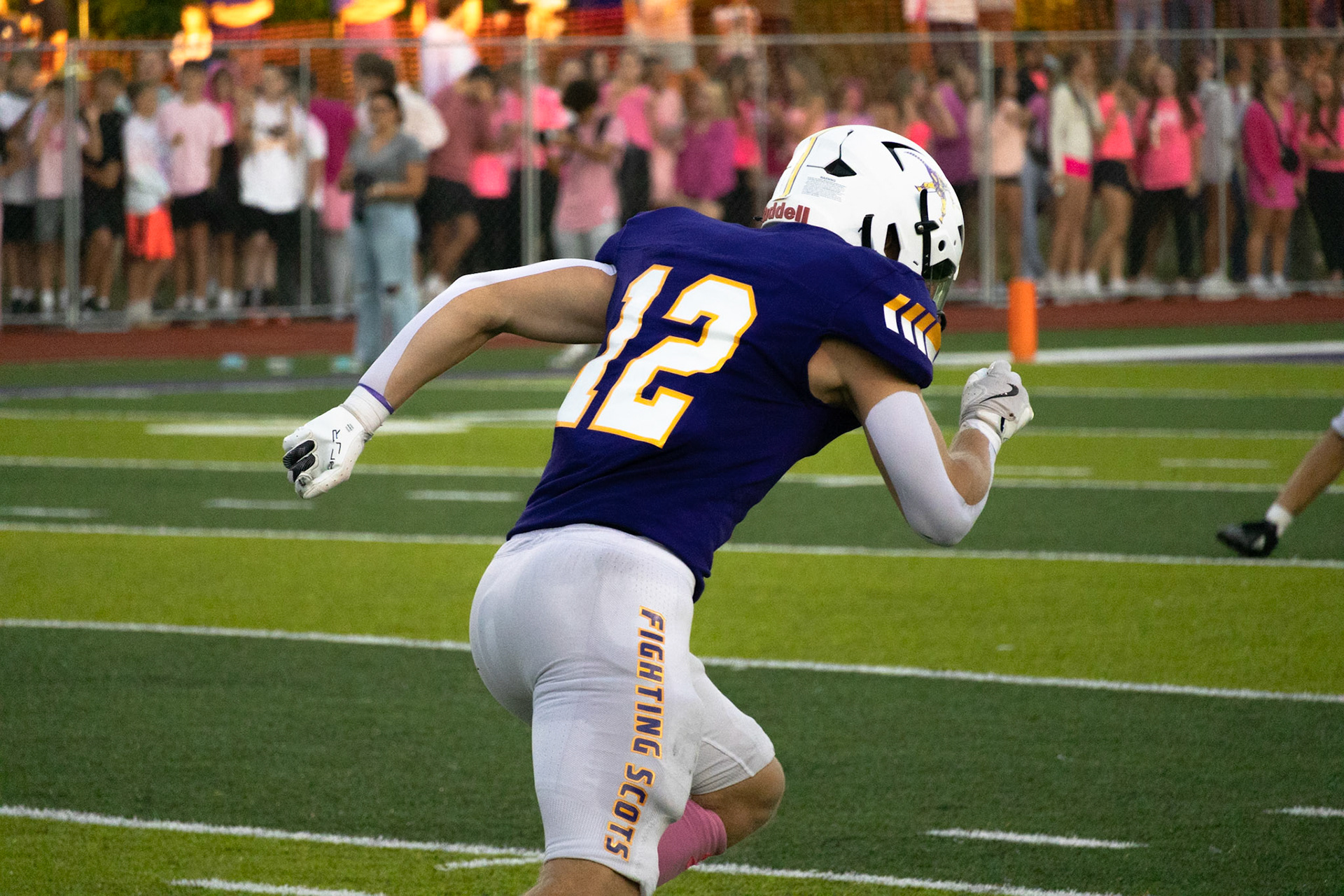 Wide receiver Lincoln Senti of the Fighting Scots sprints down the field under the Friday night lights.(Photo by Egan Otto)