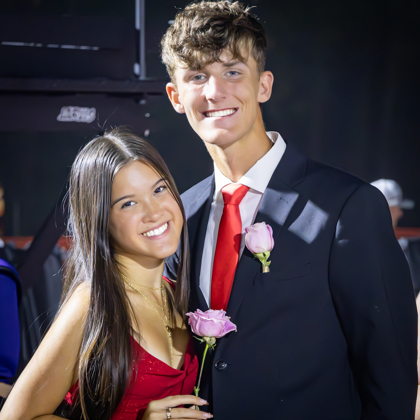 REPRESENT Seniors Audrey Duong and Isaac Robotham walk side by side in the Homecoming line, as proud band representatives. (Photo by Taya Penoes)