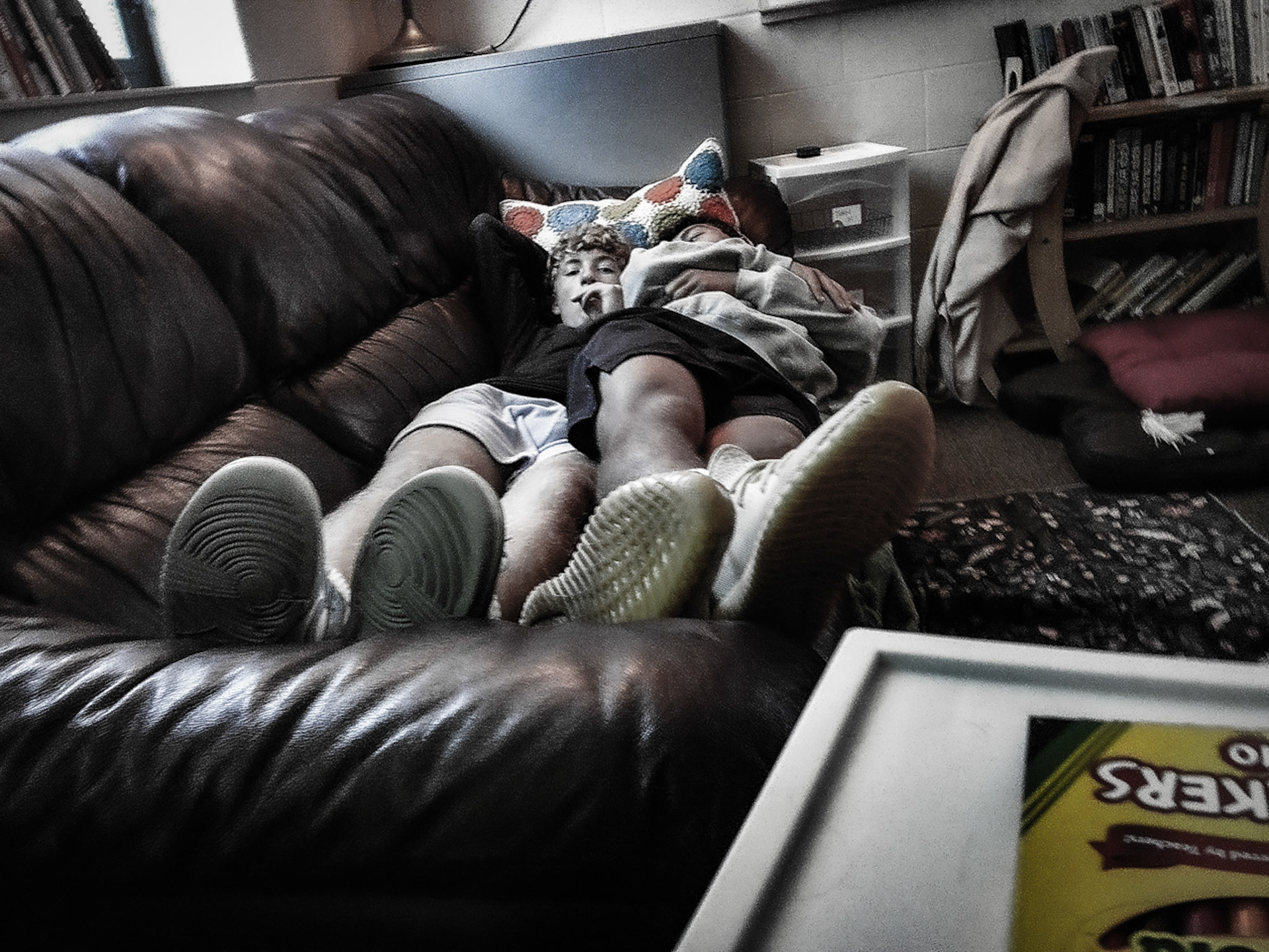 COUCH BREAK After a long day in English class, Quentin and Landry relax on the couch together. (Photo by Clayton Palmer)