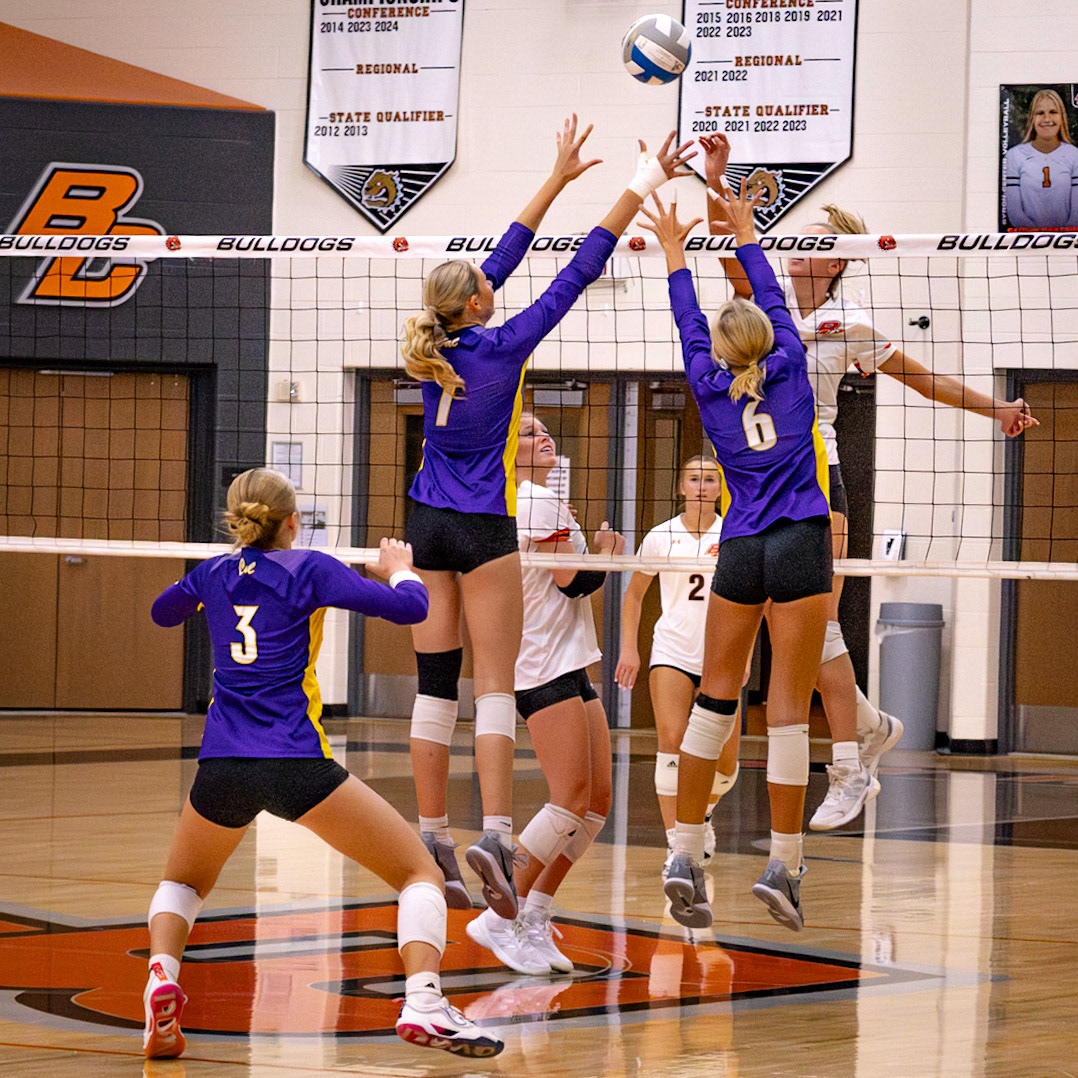 Reese Stafford and Kayla Charles rise at the net to block a Bulldogs attack. (Photo by Elsha Bytwork)