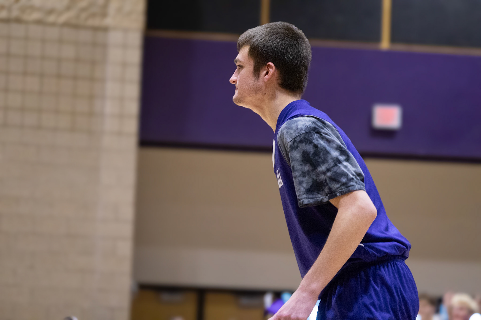 Josh Kietzman watches the court closely, ready to join the play at any moment. (Photo by Avarey Lippert)