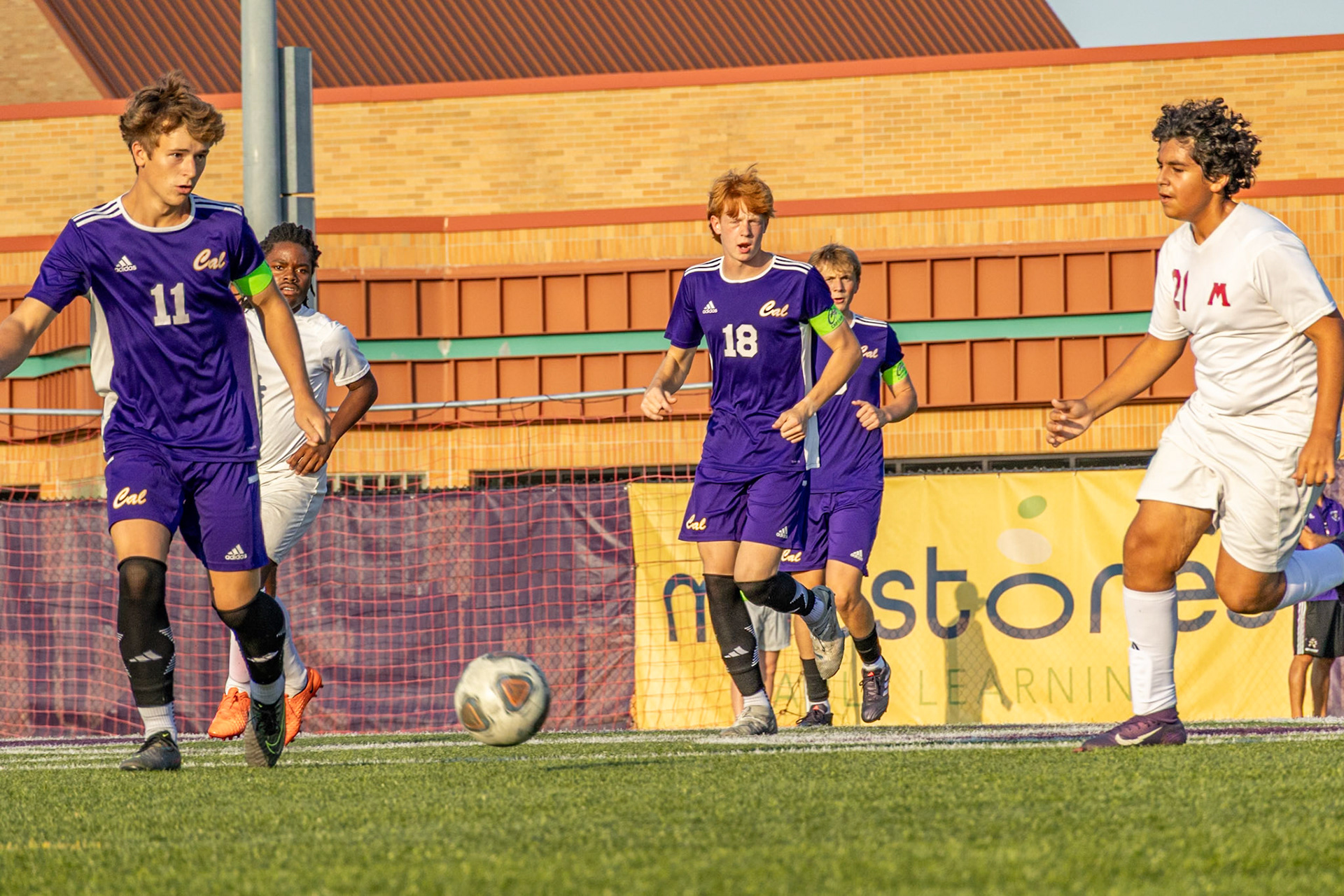 Gage Helinski going for the ball while his teamates follow the lead behind him.b (Photo by Vivian Hoffman)