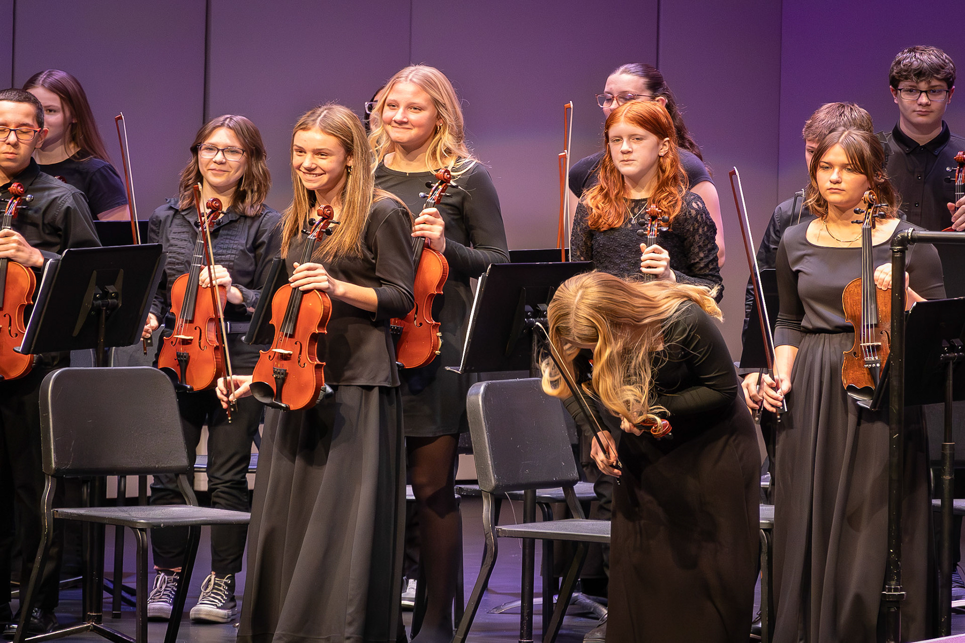 Addy Gerken is proud after completing her first high school orchestra concert. (Photo by Ava LaBine)