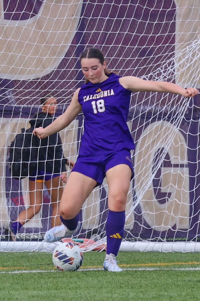 Isabella Palmitier launches the ball down the field to start the next play for her teamates. (Photo by Emma Garza)