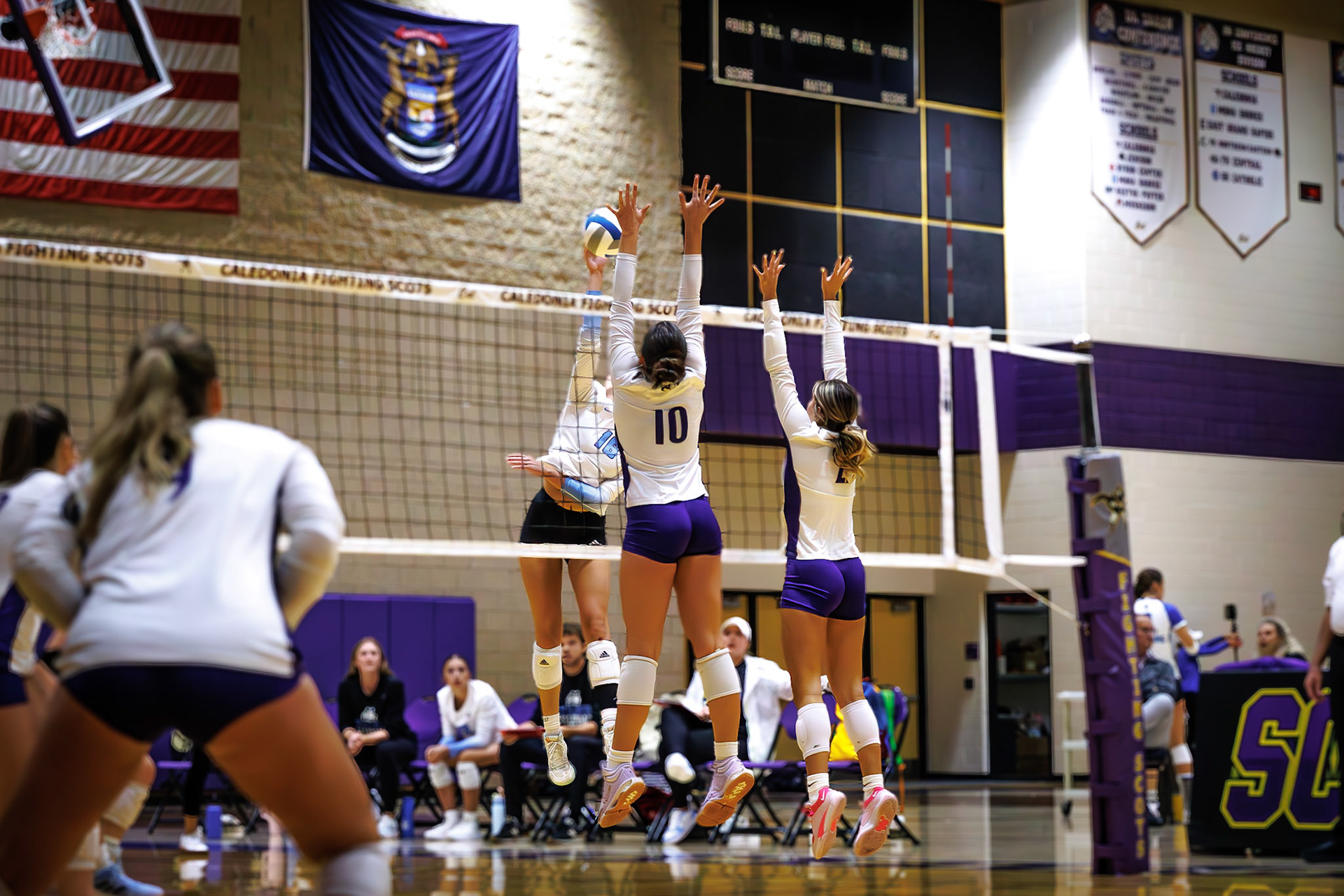 Perfect timing meets power as Lydia Bell and Kayla Briseno battle for control at the net.. (Photo by Joseph Bawi)