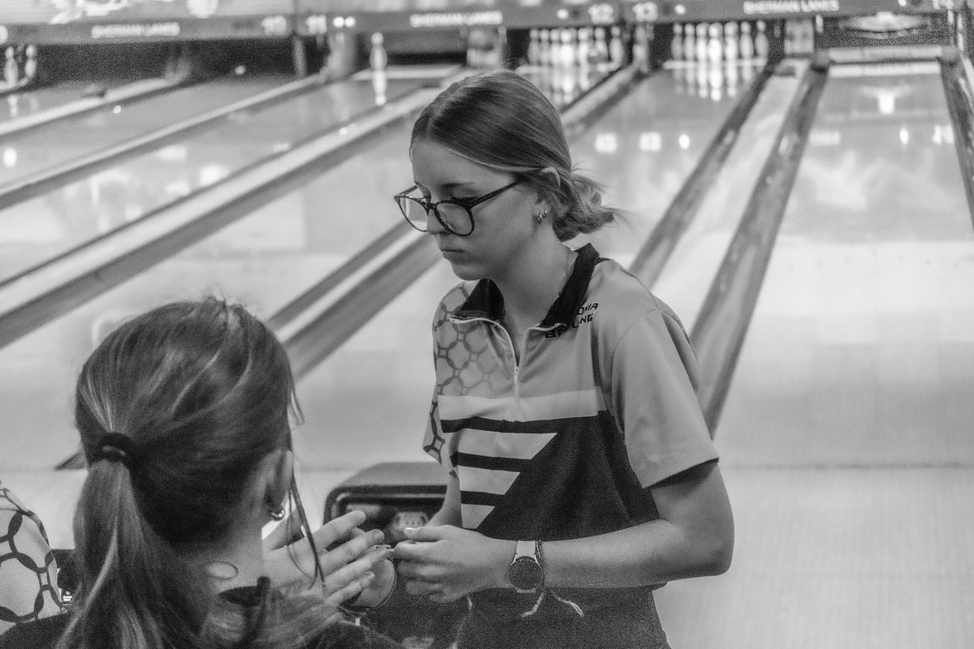 Riley Kalacanic, humble after hitting a spare. (Photo by Joseph Dunn)