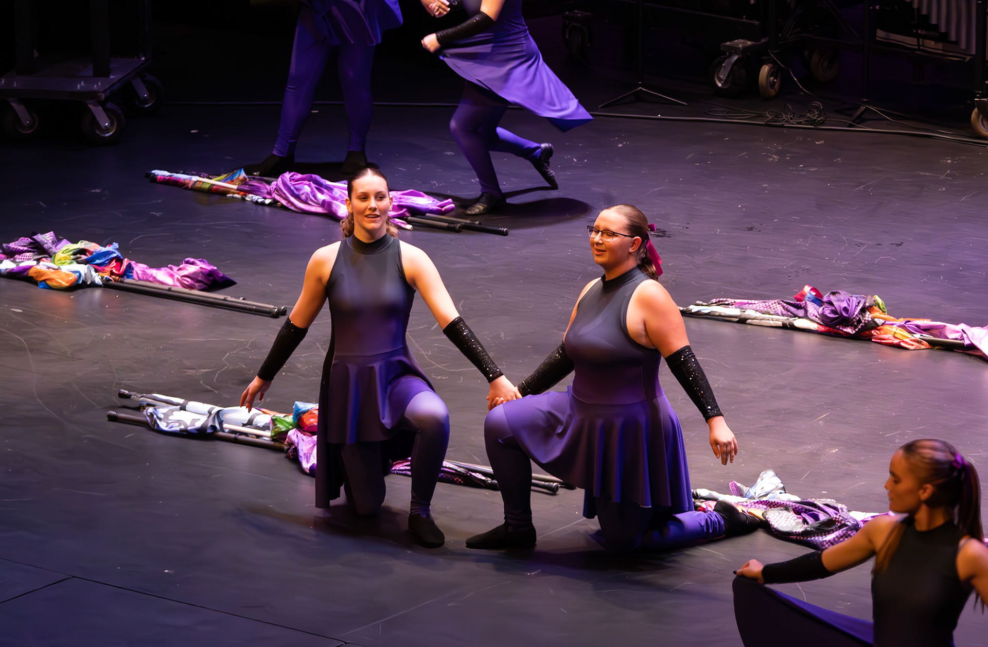 Senior Rosalyn VanStrien and freshman Emma Bradley light up the stage with their Color Guard performance. (Photo by Molly Larson)