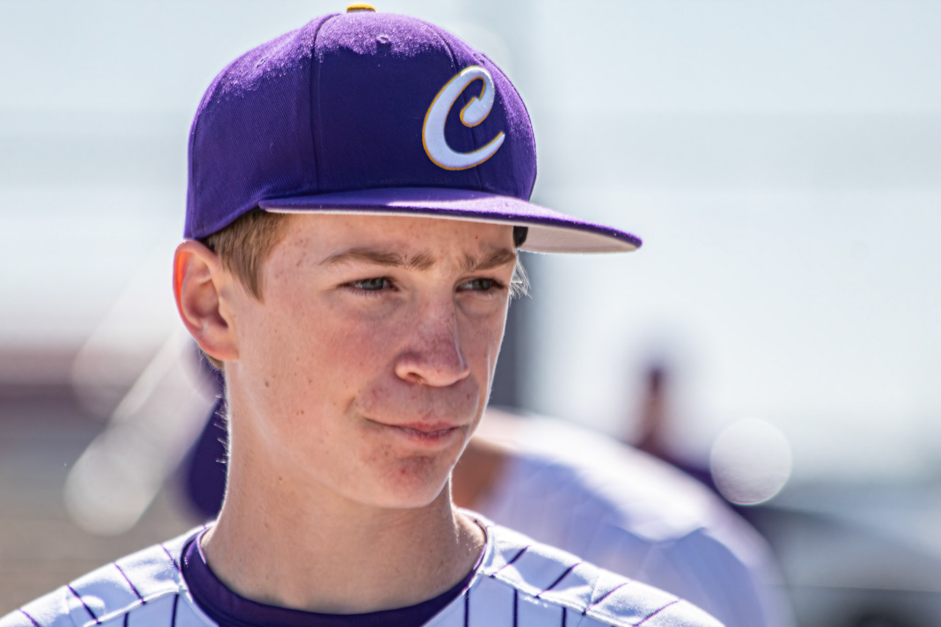 Bryce Crum listens closely to his coach’s mid-game speech as the team prepares to battle through the rest of the game. (Photo by Elsha Bytwork)