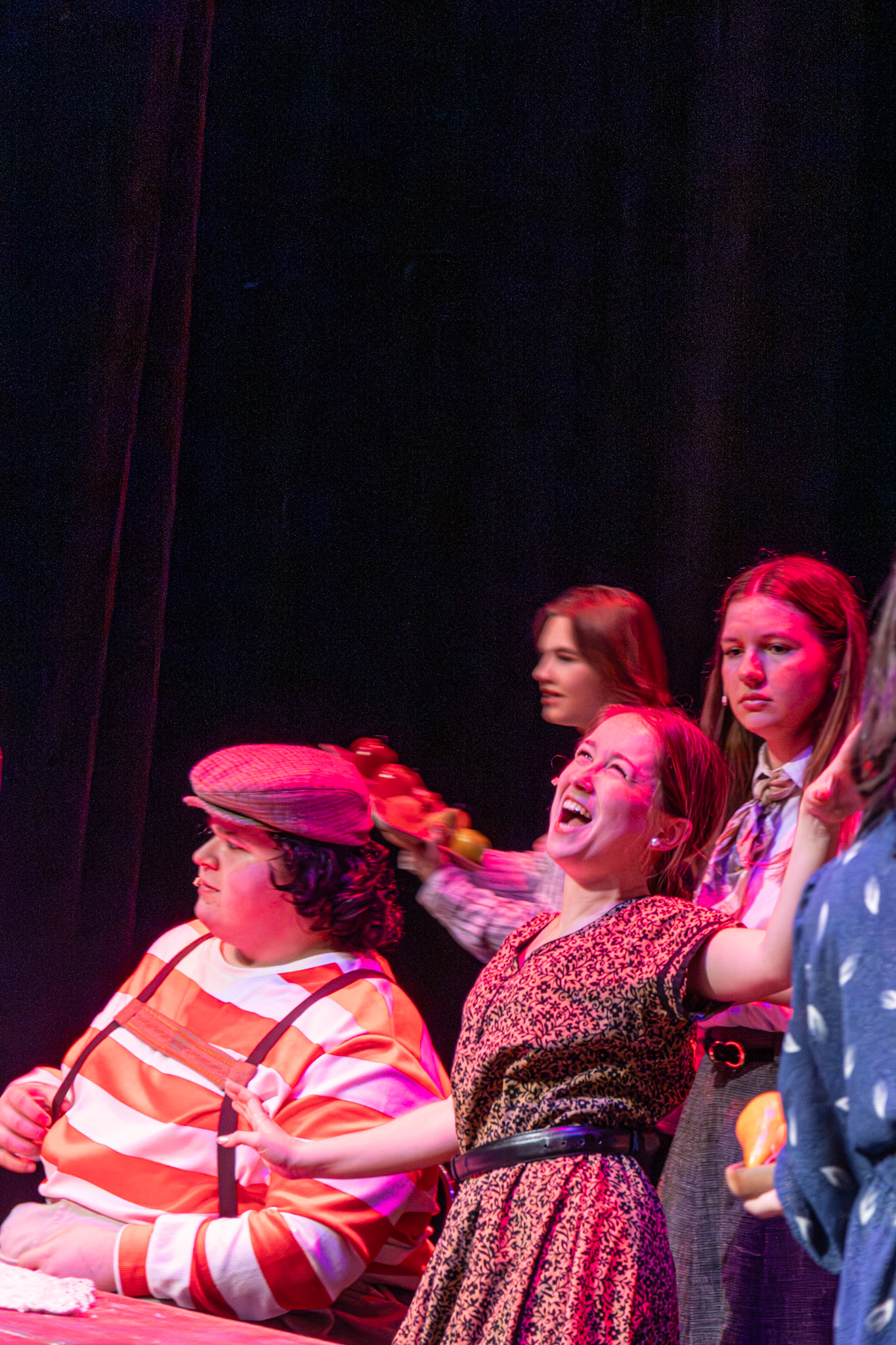 Alma Cortez-Diaz basks in the spotlight during “I Eat More,” joined by Stella Barnwell and Austin Robinson. (Photo by Deegan Pecha-Gnat)