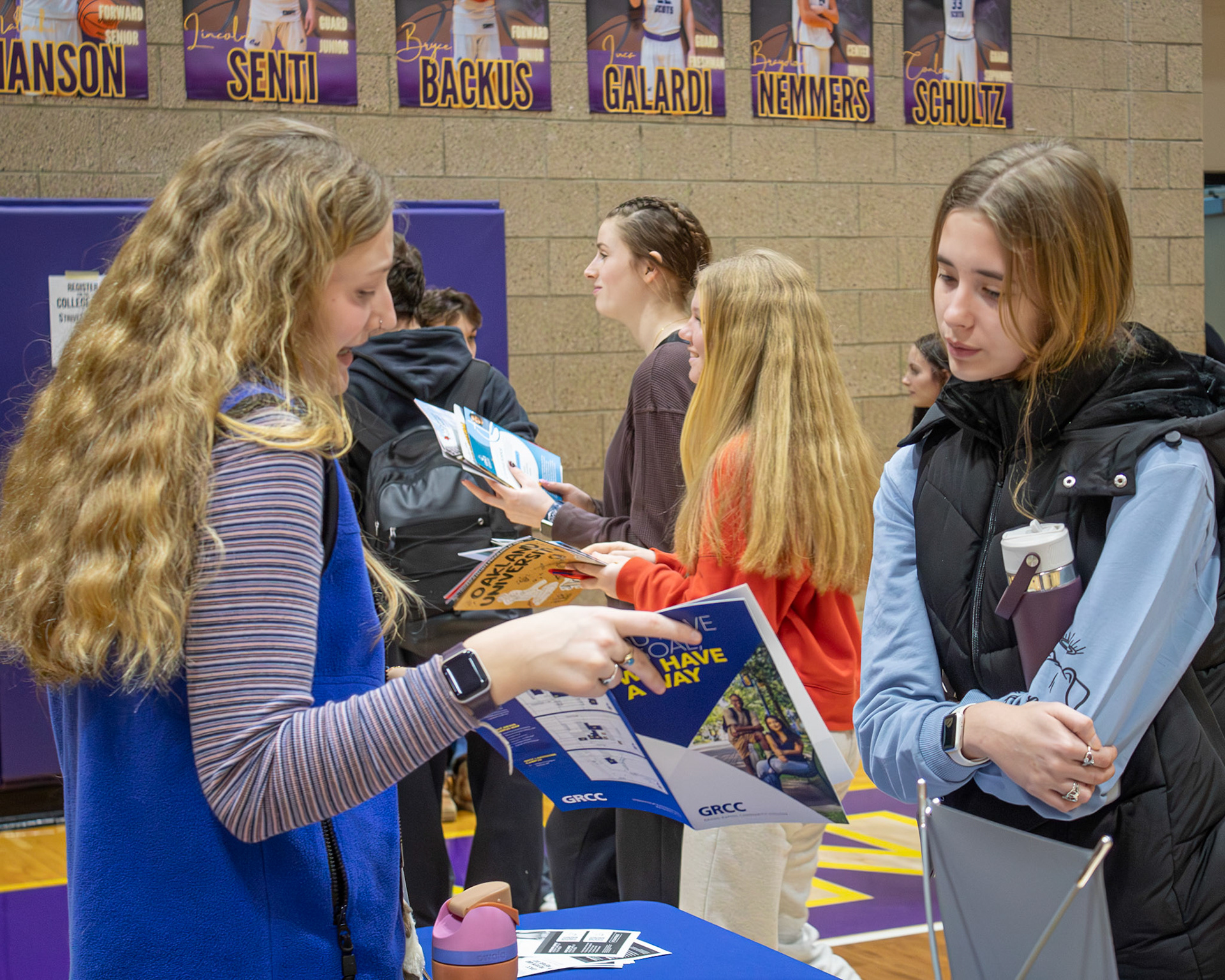 Ella Schultetus pays close attention as a representative shares information at the college fair. (Photo by Mya VanderZwaag)