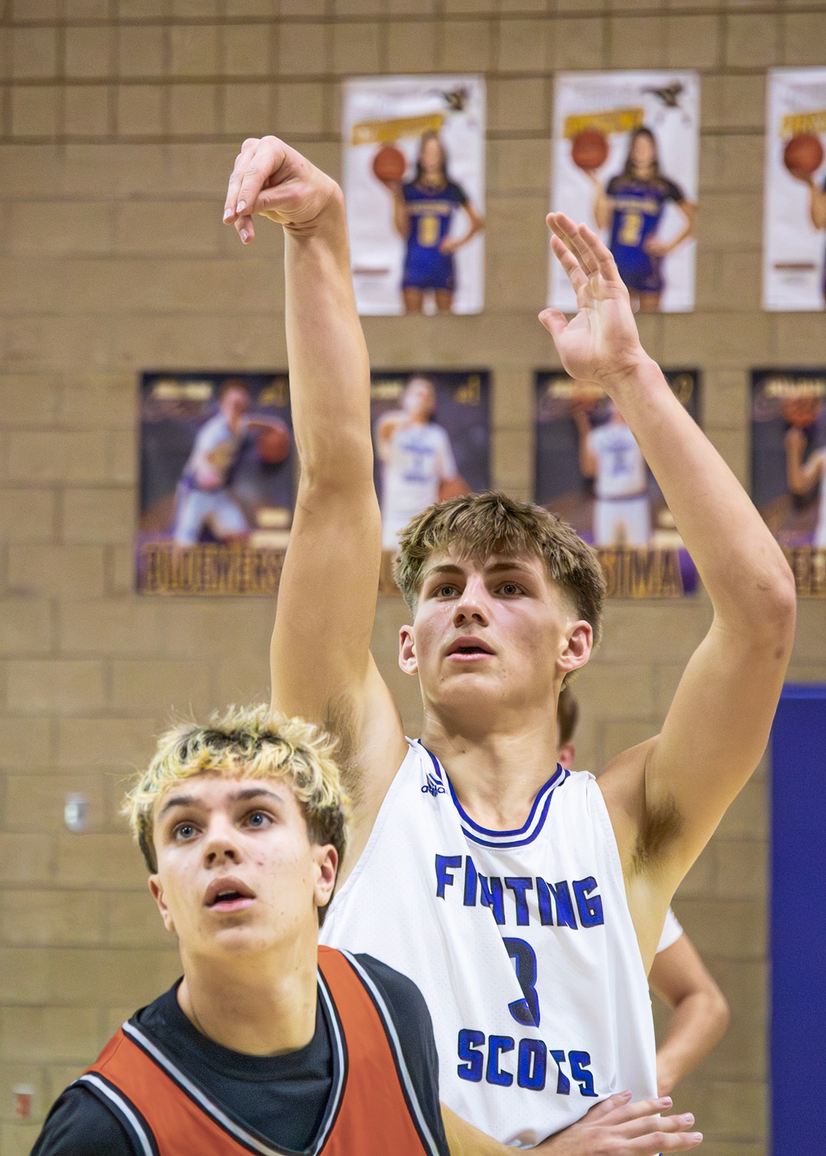 Ben Geerdes watches steadily as his shot heads toward the basket, waiting to see if it falls. (Photo by Emma Garza)