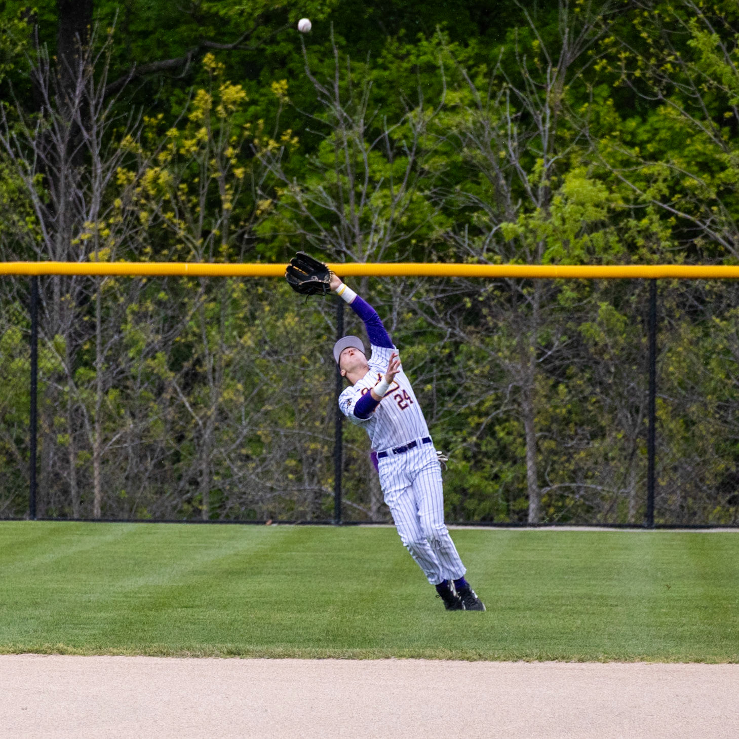 Carter Berends reaches for the ball in right field and makes the catch.  (Photo by Justin Harper)