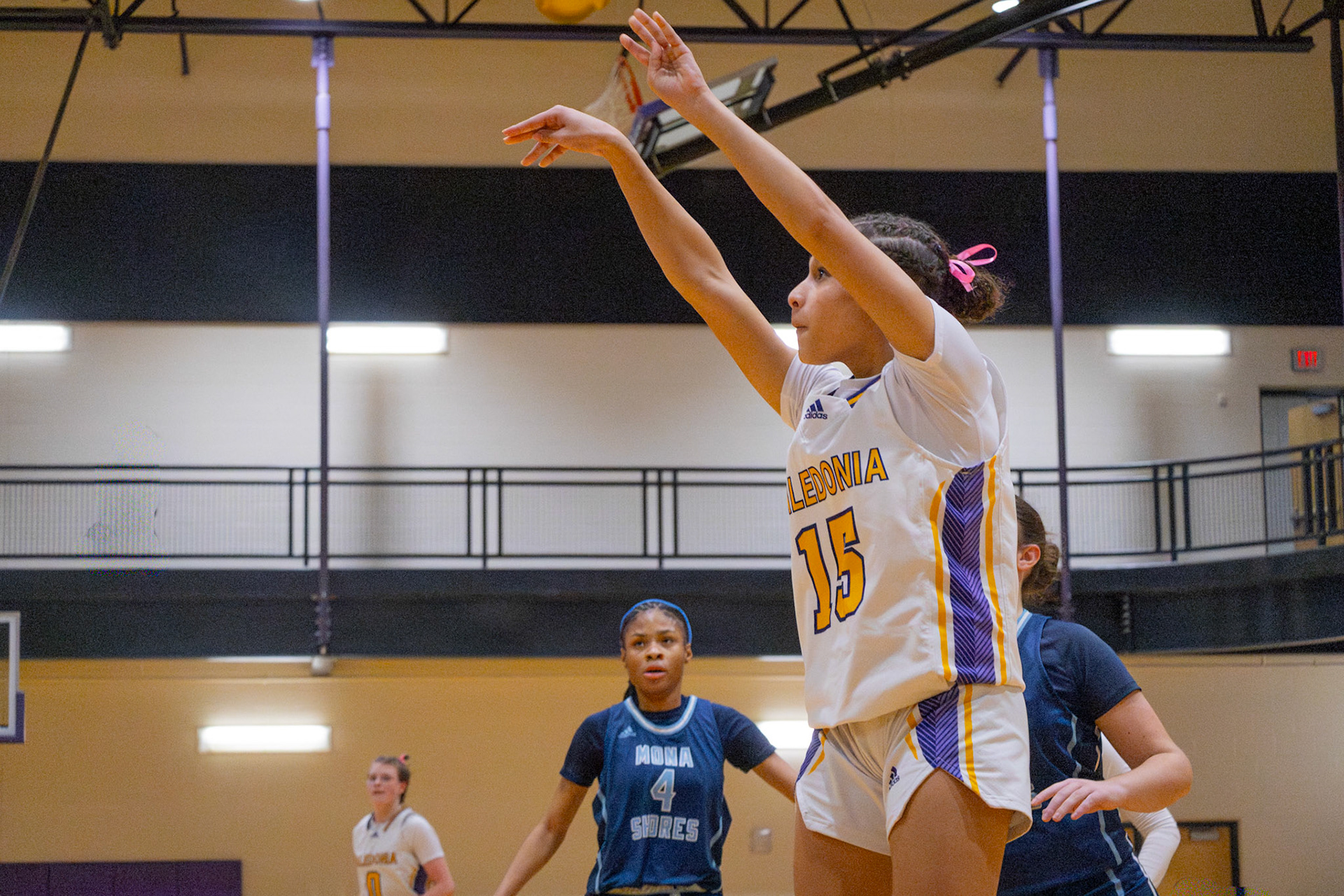Melanie Genao-Grullon shoots a 3-pointer to add to Caledonia's lead over Mona Shores. (Photo by Abigail Douglas)