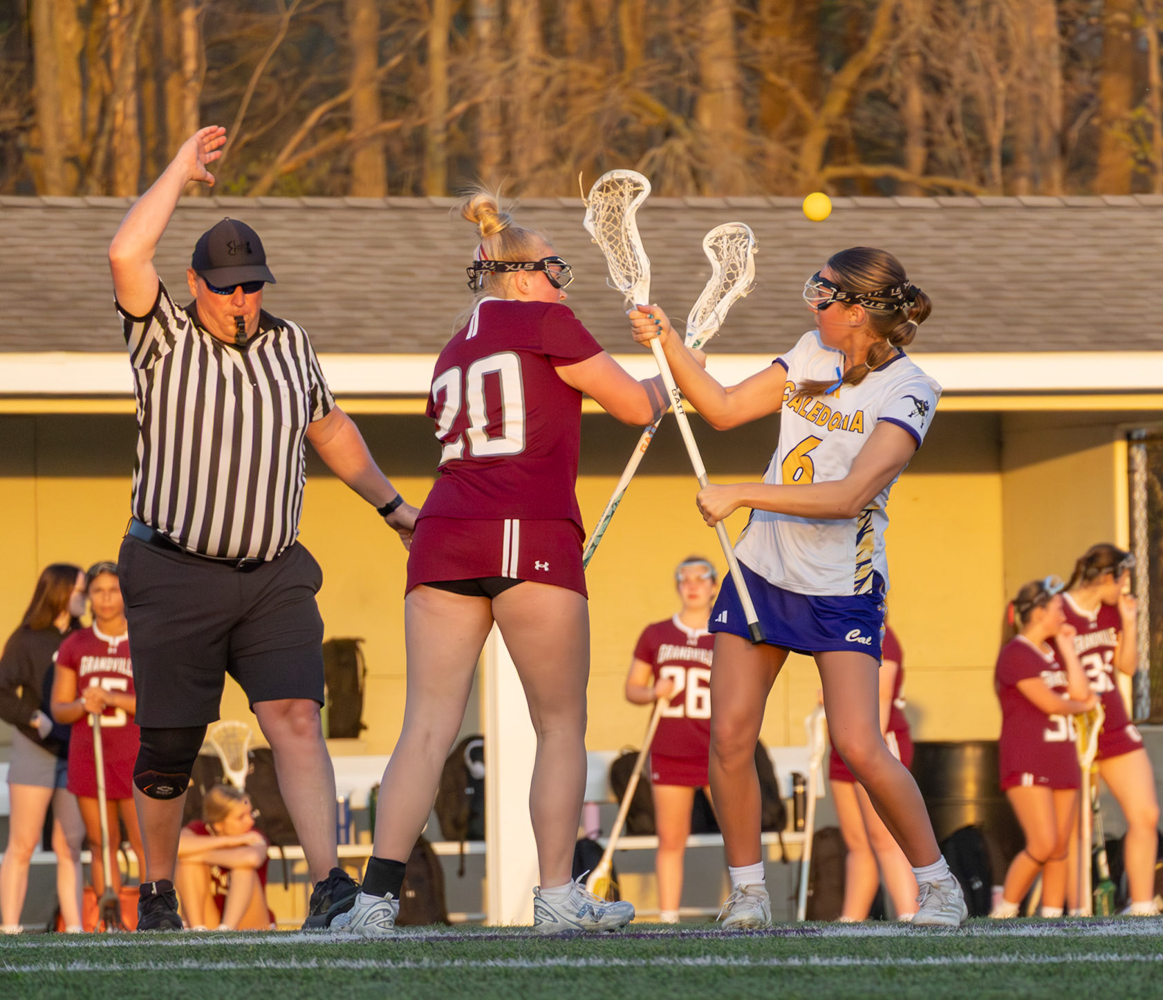 Vivian Fink battles for possession on the draw and tips the ball back toward her teammates. (Photo by Ellie VanderRoest)