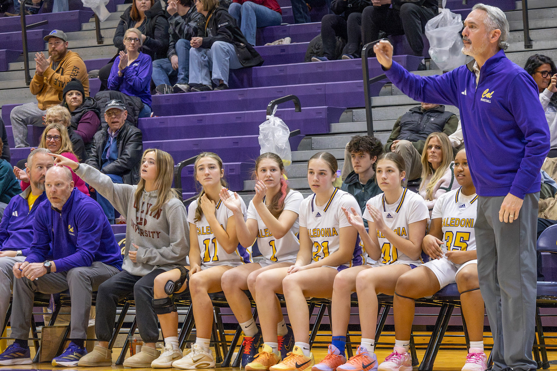 The Caledonia bench brings the energy, supporting every play from the sideline. (Photo by Landry Mueller)