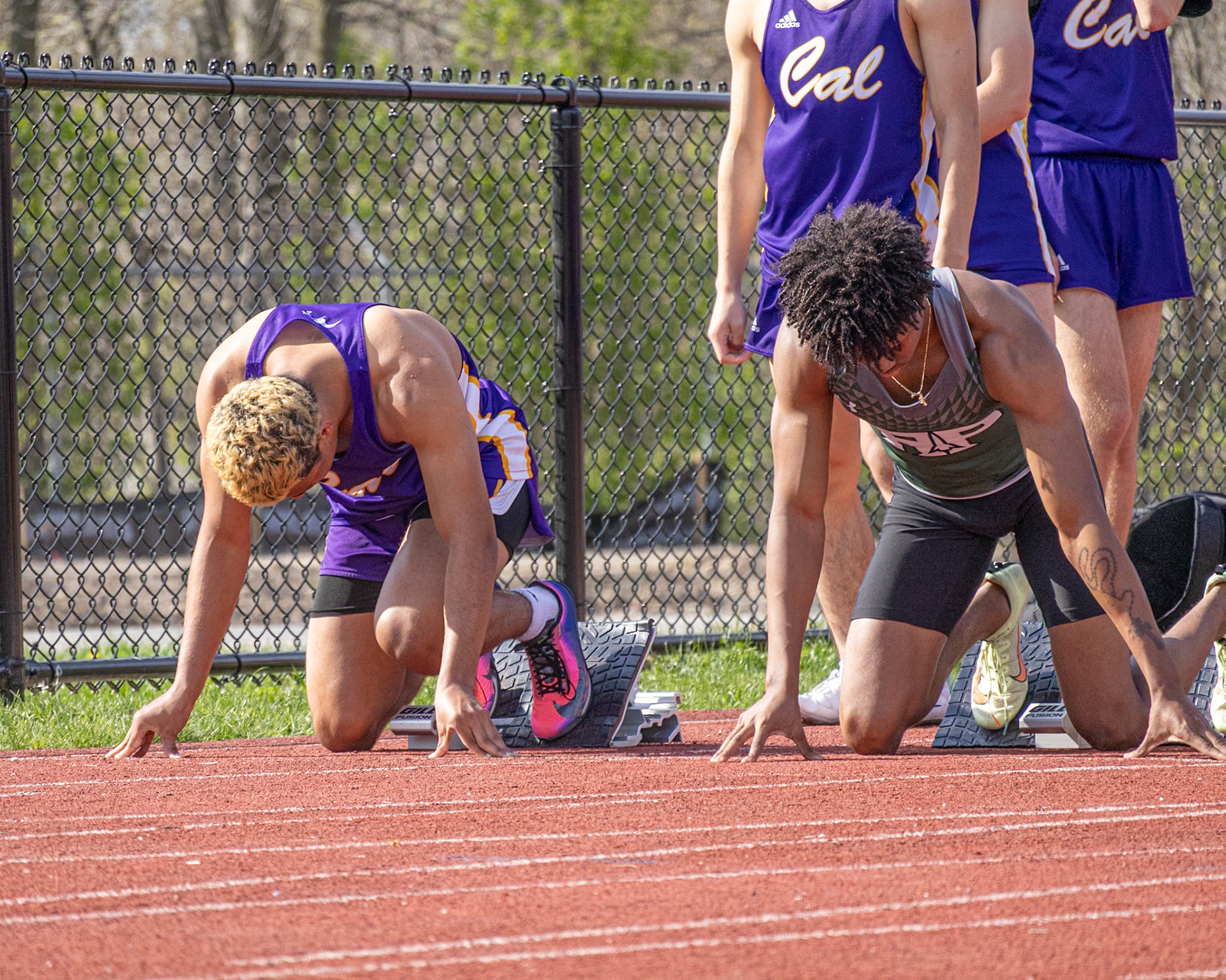 In the 100 meter dash, Robert Restau prepares to put his all into this race. (Photo by Emma Garza)