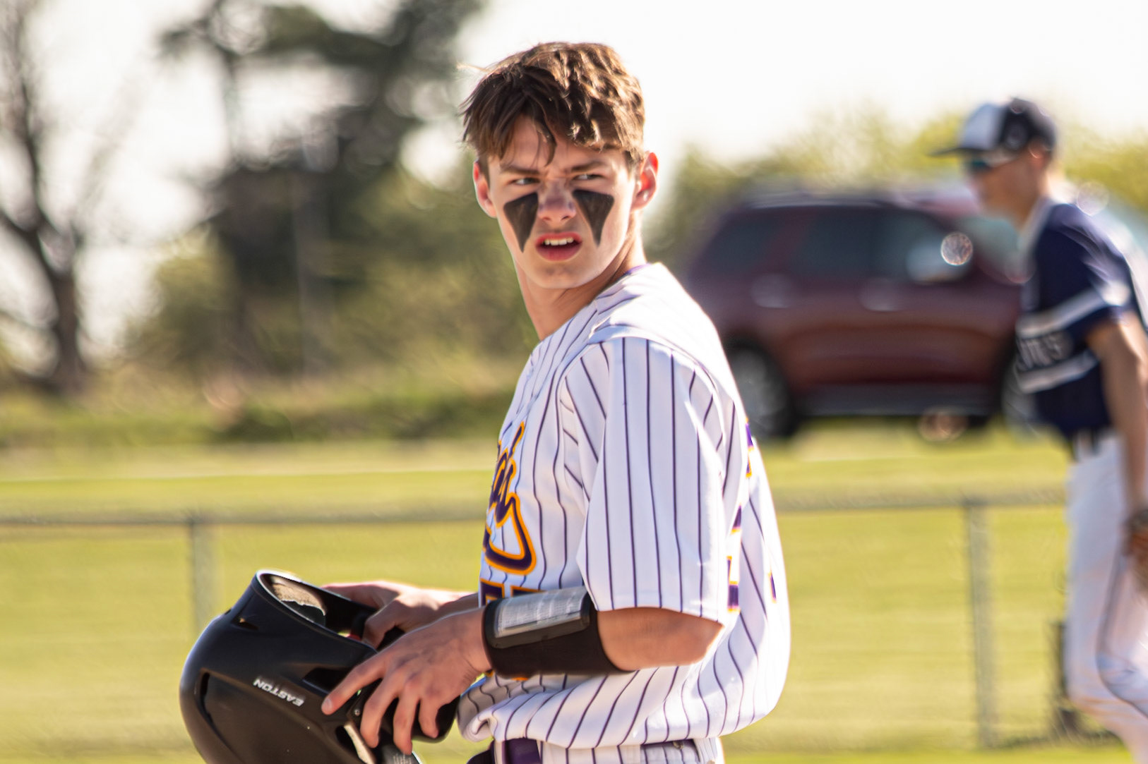 Austin Guider storms onto the field and fires a look toward his teammates after the sideline chatter, locking everyone back in and ready to play. (Photo by Elsha Bytwork)