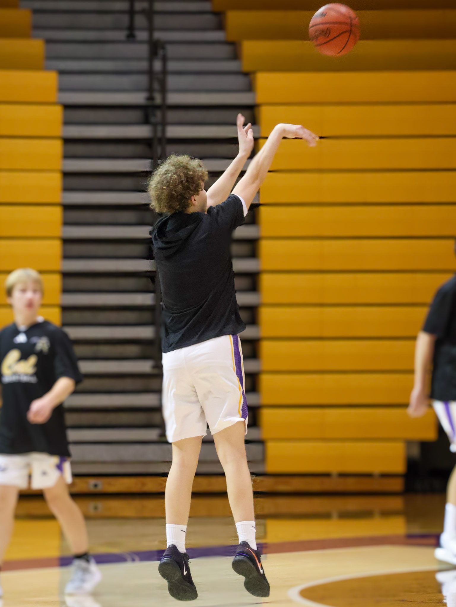 Focused before the first whistle—Isaiah Smith elevates during pregame practice. (Photo by Mackenzie Popma)