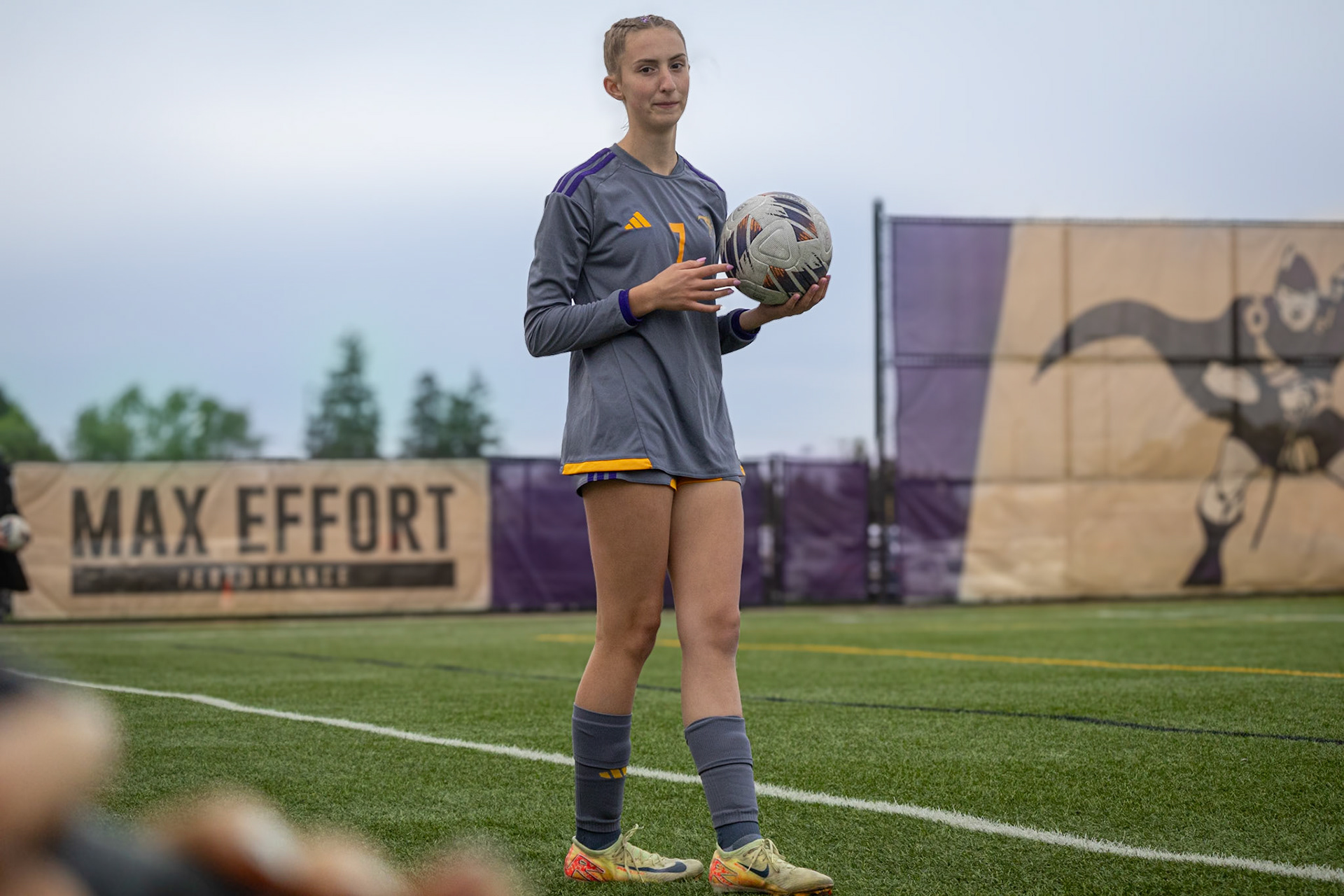 Natalie James flashes a look at the camera before throwing the ball back into play. (Photo by Ava LaBine)