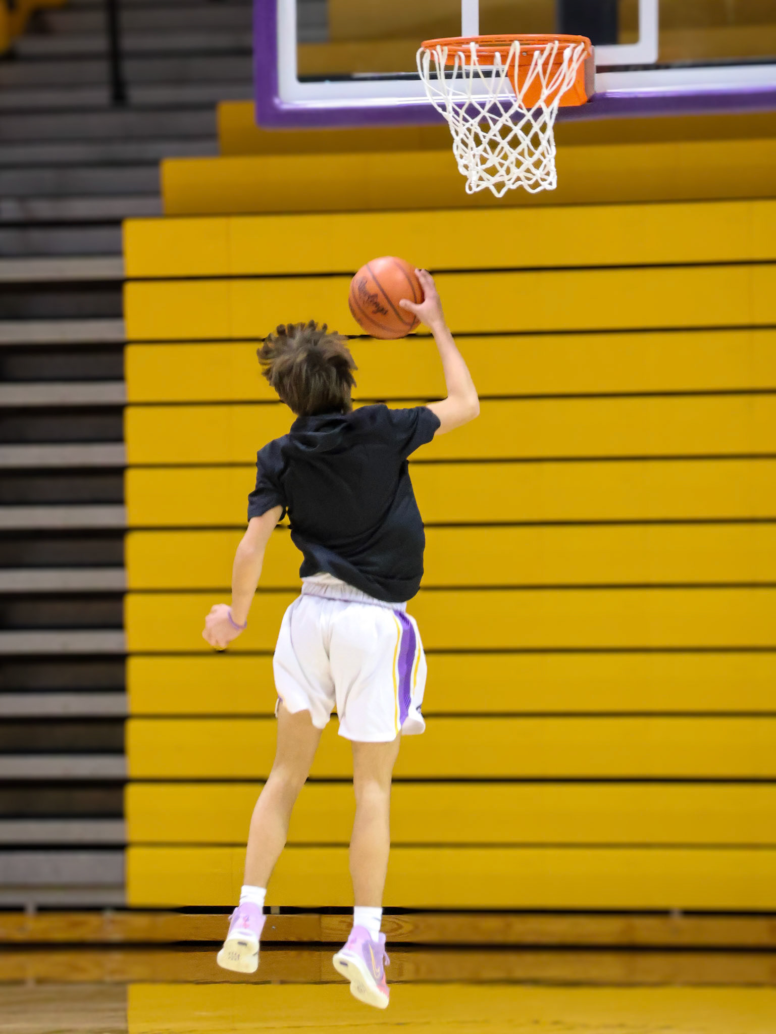 One hand, all focus. Cole Thompson rises up while perfecting his shot before the game. (Photo by Mackenzie Popma)