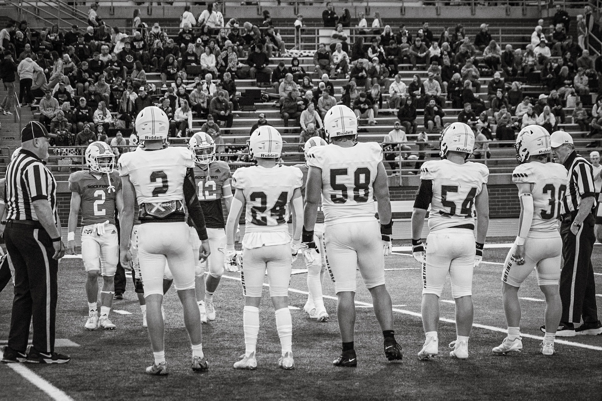CAPTAINS CLASH Caledonia football captains face off against rival Rockford Rams. (Photo by Egan Otto)