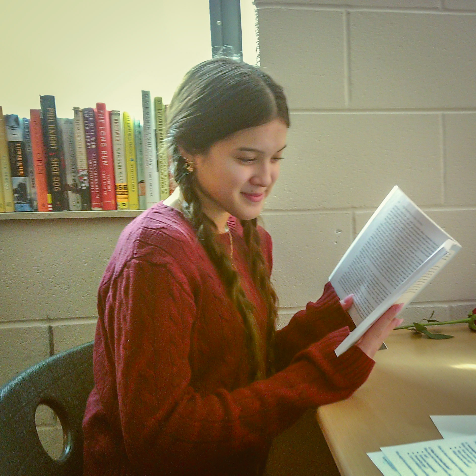 Audrey Duong after a rose was dropped off on her desk. (Photo by Ella-Grace Wickens)