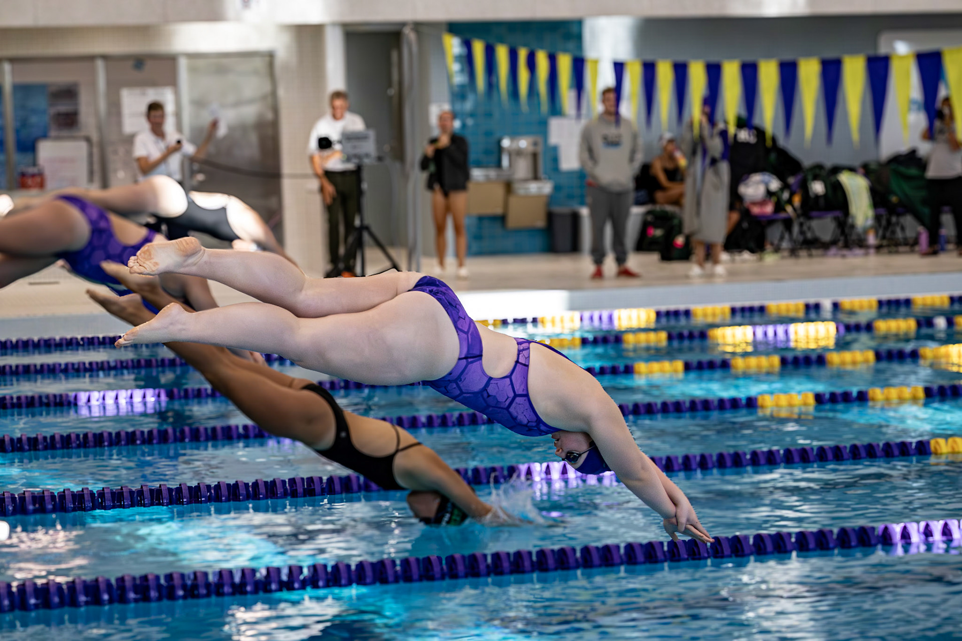 SOLID START Kay Hurst starts off with a beautiful dive for the 100 yard freestyle. (Photo by Lena Gesing)