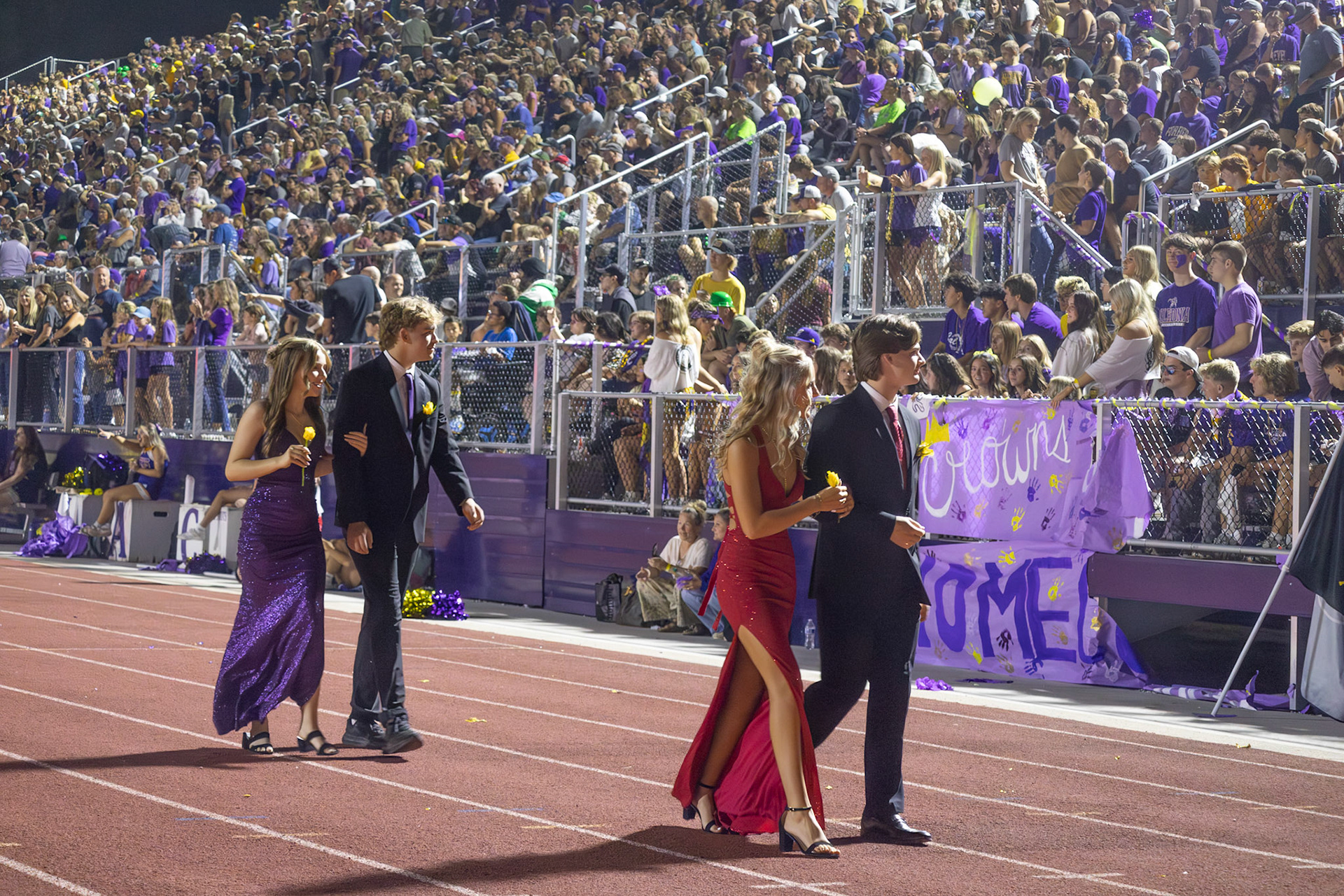Homecoming king and queen nominees walk back after the announcement. (Photo by Milana Rico)