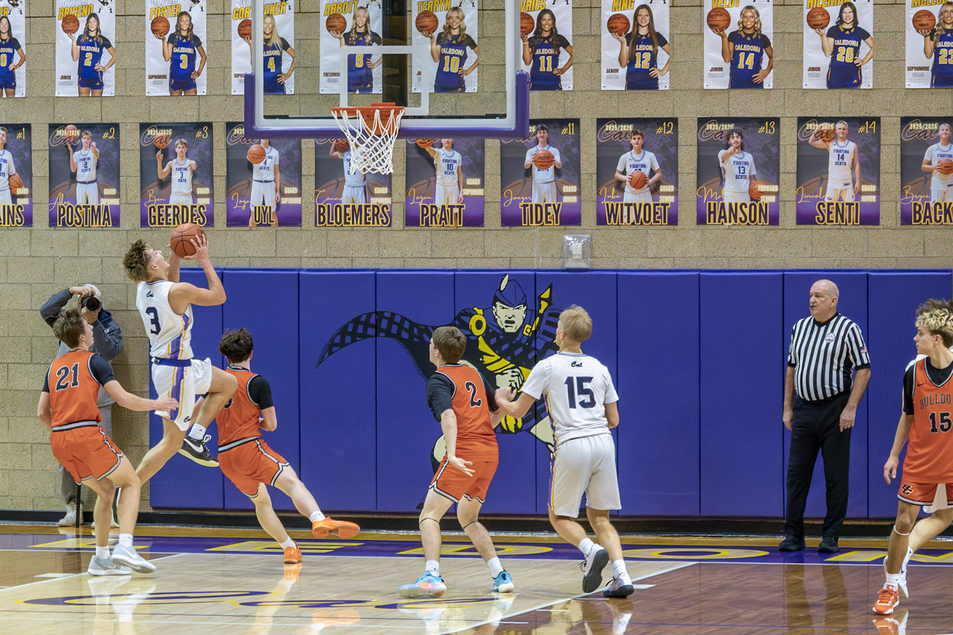 Ben Geerdes aggressively attacks the rim in an attempt to score for the Fighting Scots. (Photo by Emma Garza)