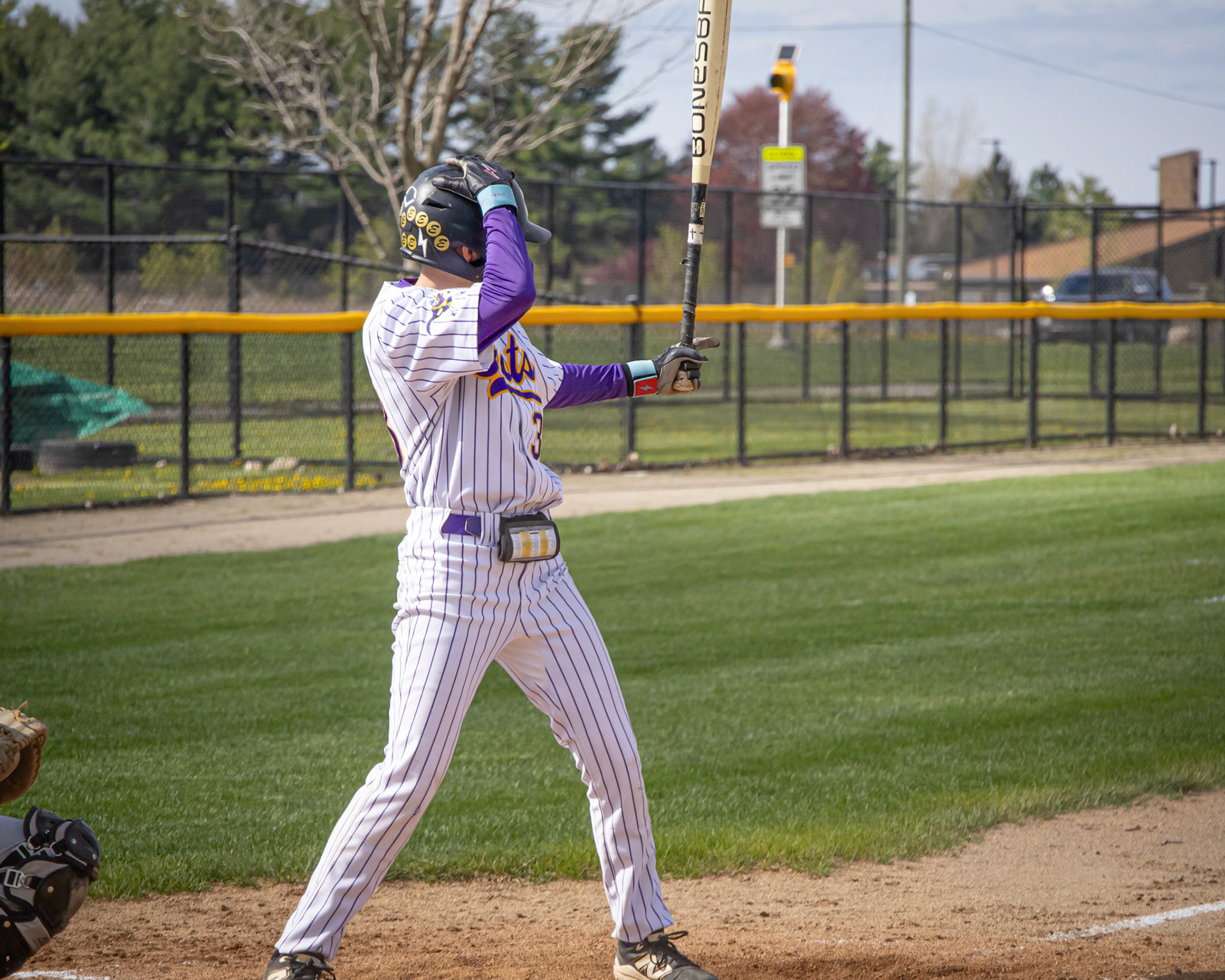 After asking for time from the umpire, Landon Horan quickly adjusts his helmet before the next pitch.  (Photo by Ella-Grace Wickens)