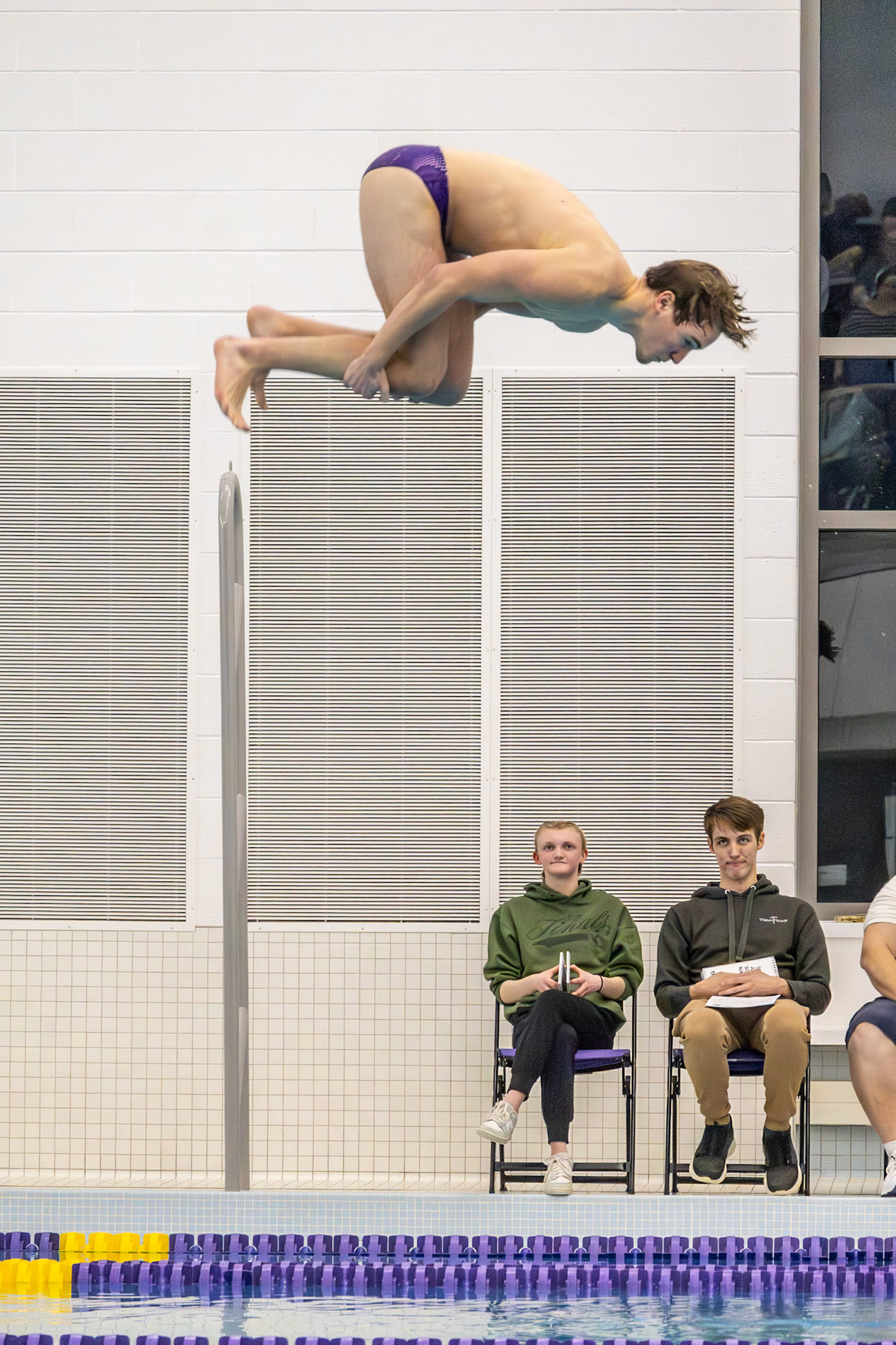 Austin Tufts begins his event with a dive during the meet against the Wayland Wildcats. (Photo by Hailey Thayer)