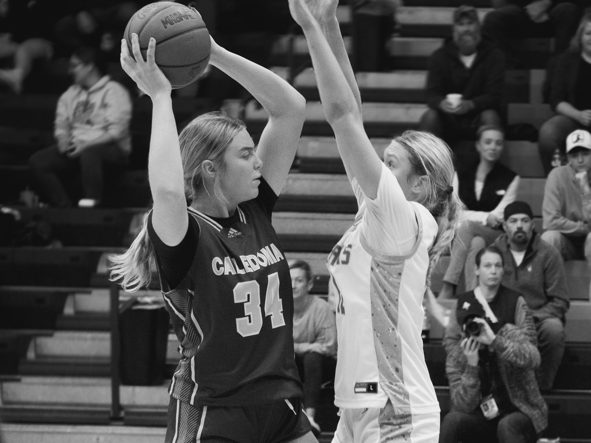 Sophmore Mallory Graham looks around the court for an open teammate. (Photo by Kortney Muller)