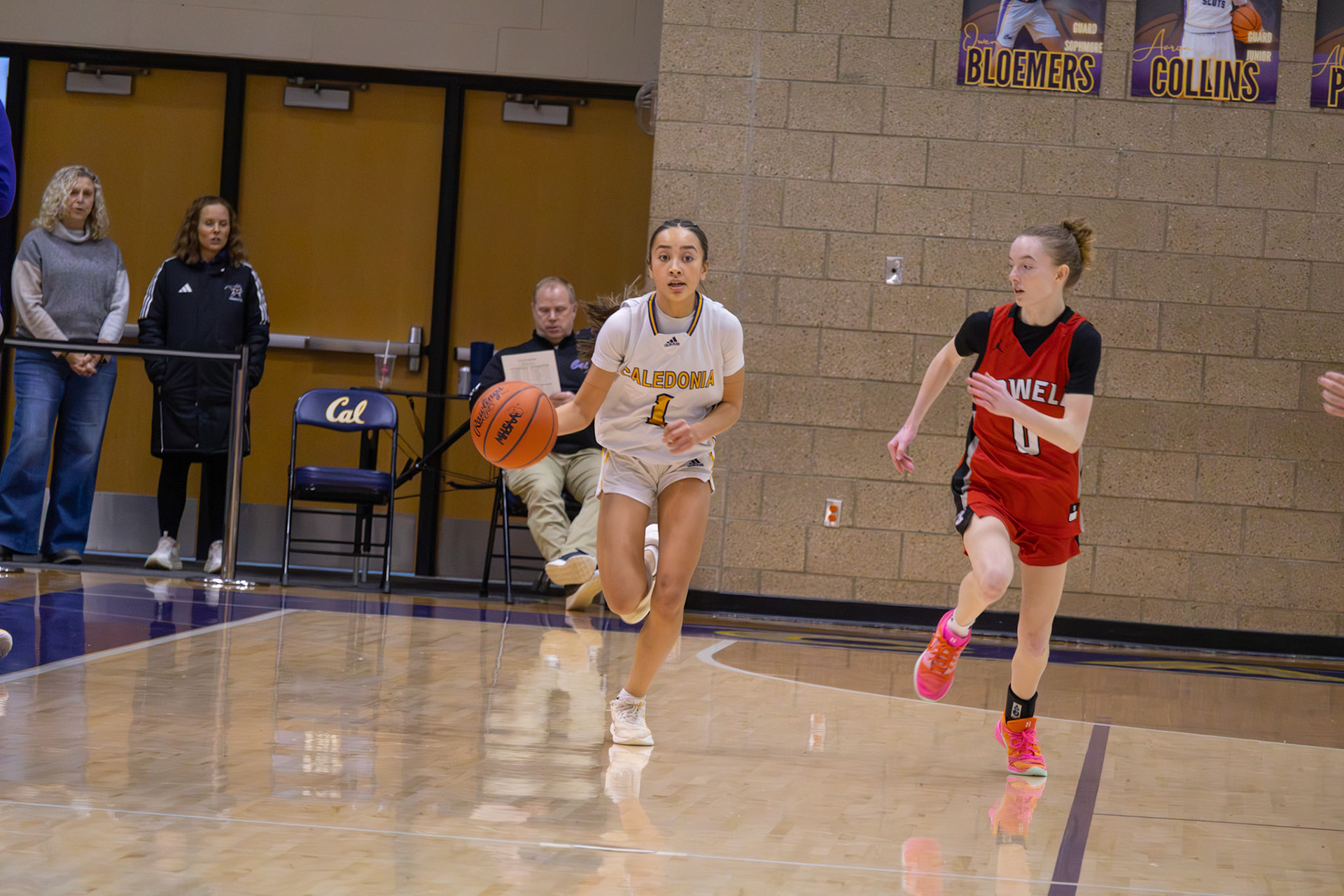 Braylee Tep pushes the ball up the court for the scots during fast break action. (Photo By Landry Mueller)
