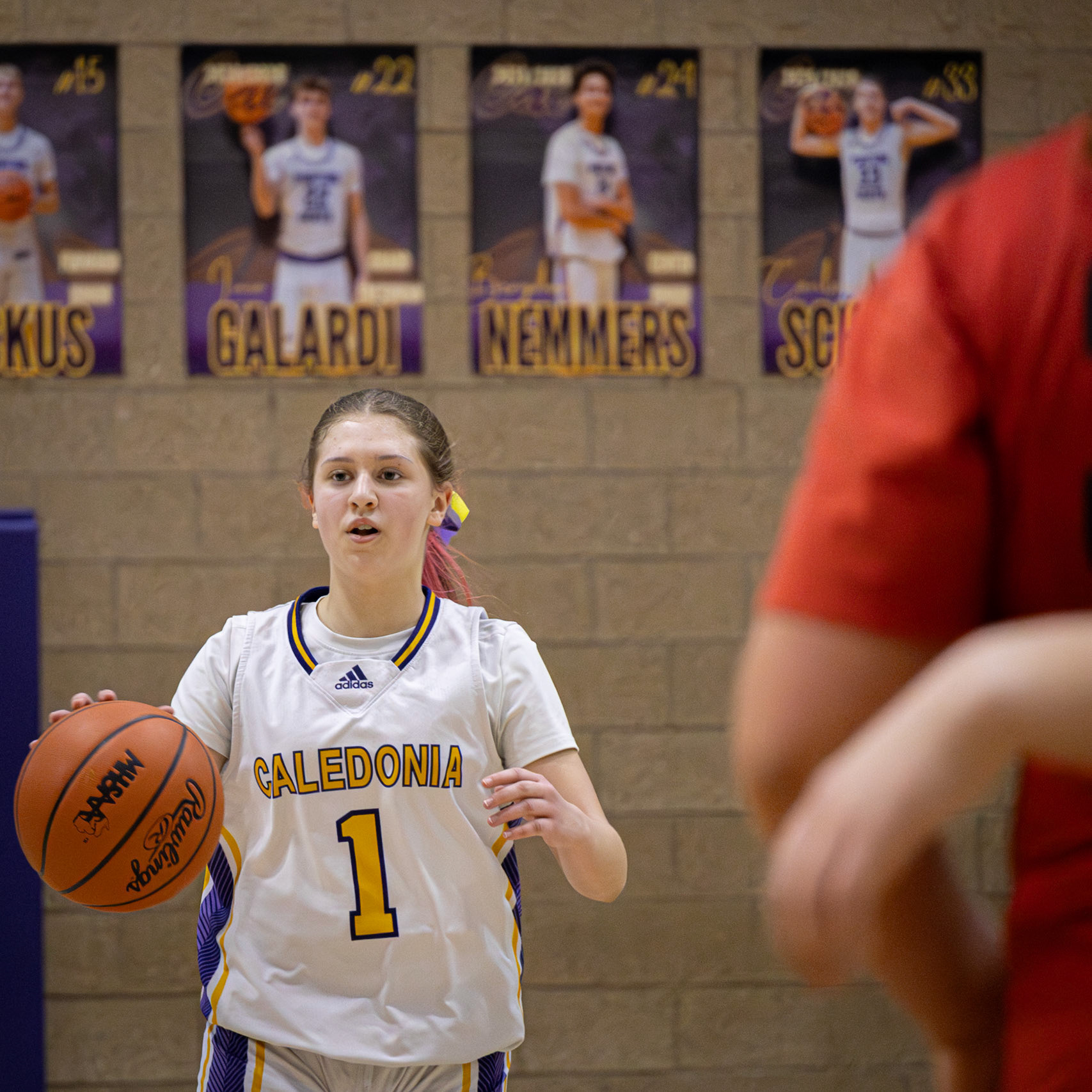 Aunestea Hanson brings the ball up the court, staying composed and in control of the offense. (Photo by Landry Mueller)
