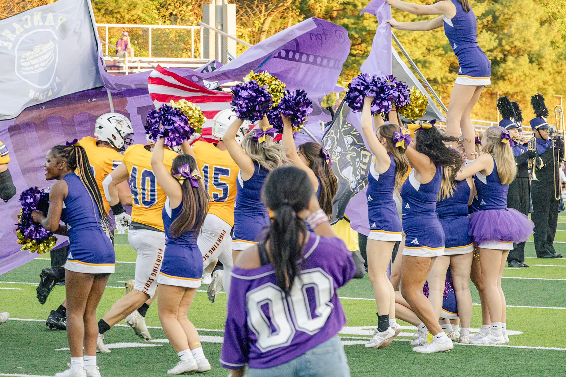 The boys charge onto the field in a roar of excitement. (Photo by Taya Penoes)