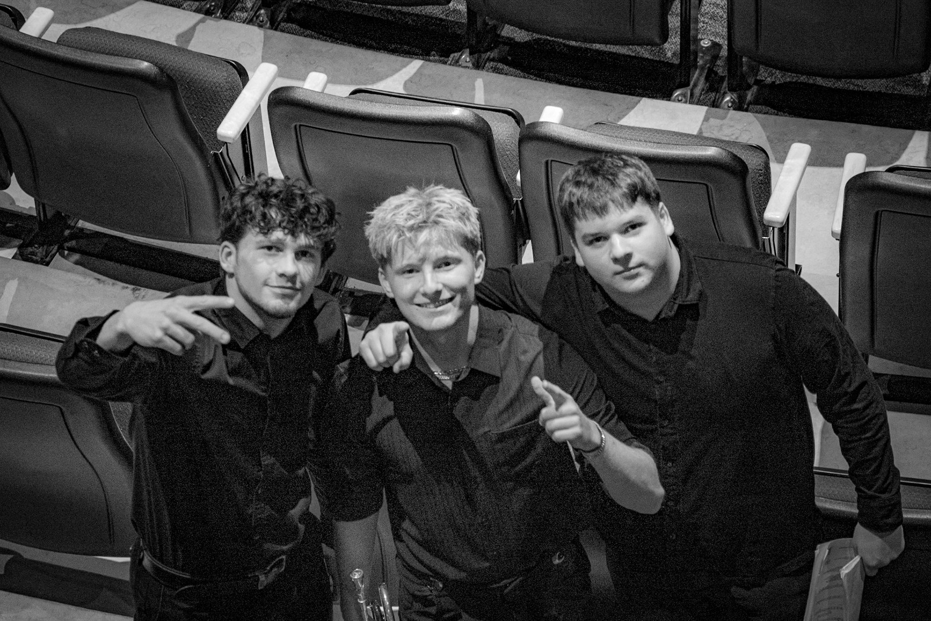 Seniors Ben Moss, Joe Visel and Grant Geer take a photo together for the end of the last fall concert. According to Joe, "It's sad it's the last fall concert but I am already looking forward the holiday show." (Photo by Jaren King)