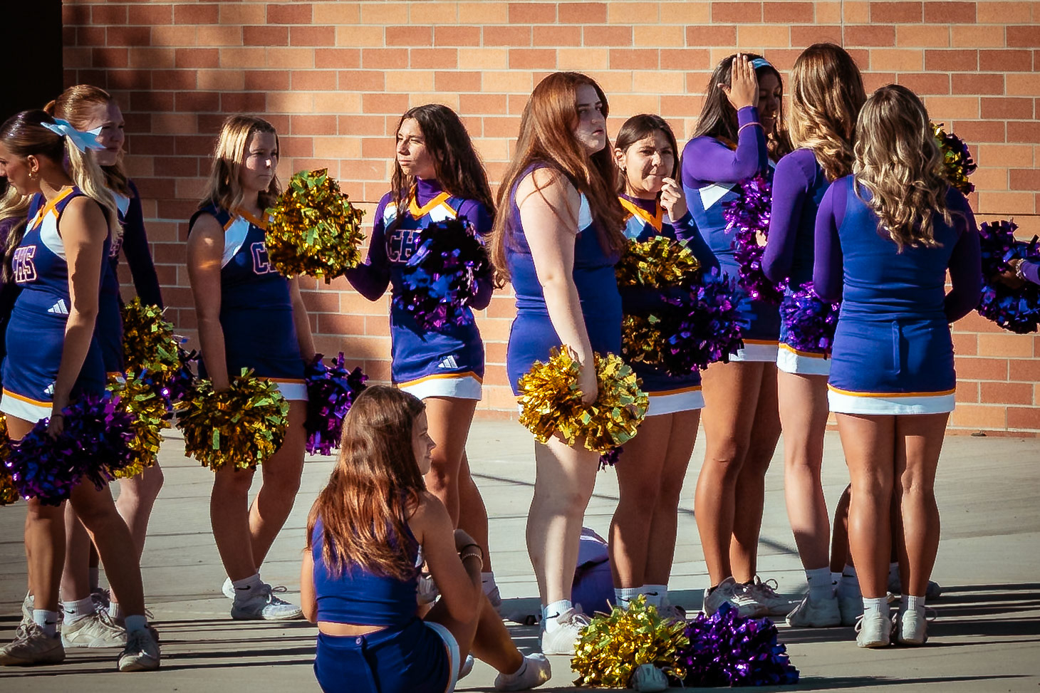 Cheerleaders wait to perform at the stadium's ribbon cutting ceremony. (Photo By Kayley Martin)