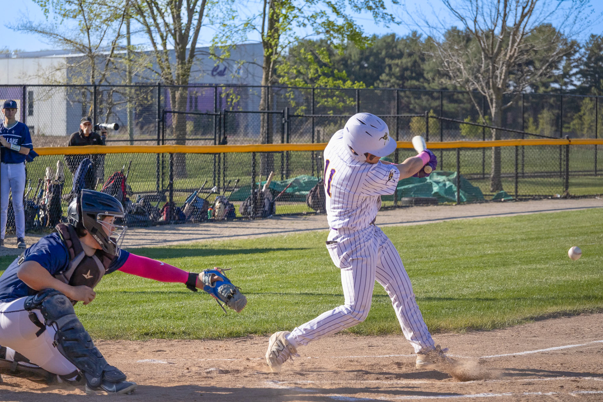 Launching a line drive past the shortstop on a full count, Ty Lewandowski reaches first with a base hit and adds another RBI to his season total. (Photo by Ella-Grace Wickens)