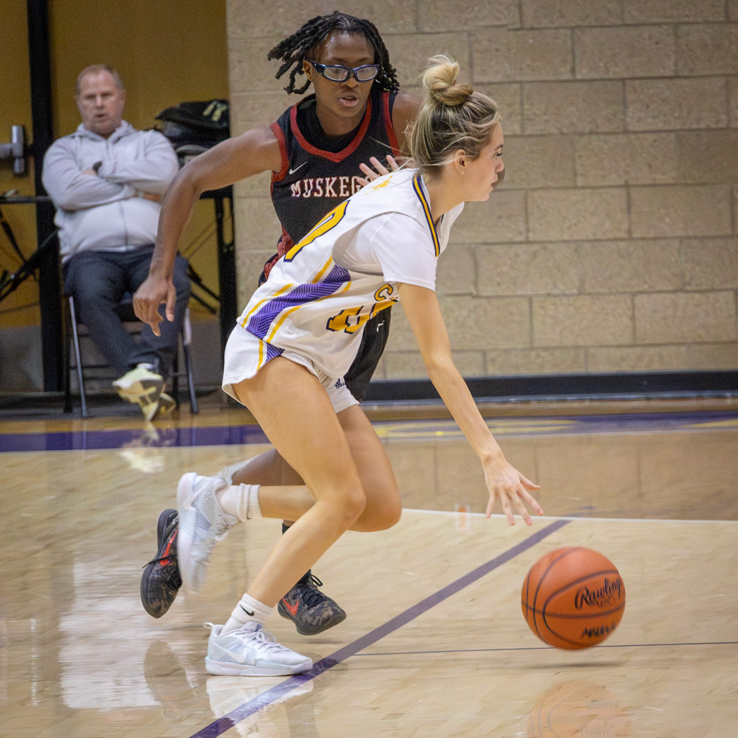 TO THE RIM Maya Terryn drives toward the basket under tight defense during the Muskegon matchup. (Photo by Taya Penoes)