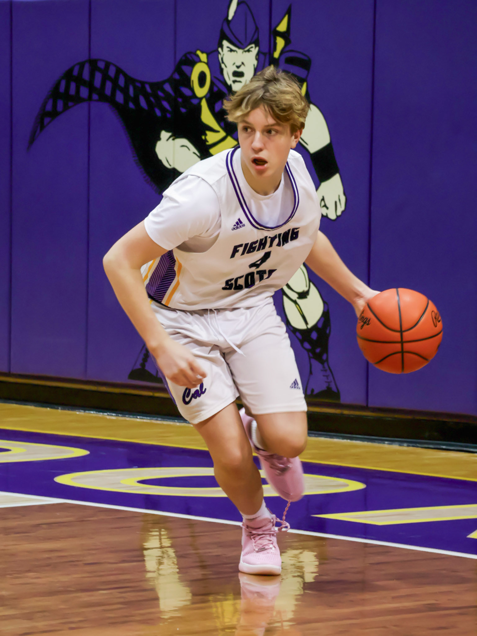 Steal complete. Focus set. One glance ahead and Braden Pratt is already racing to the other end of the court. (Photo by Mackenzie Popma)