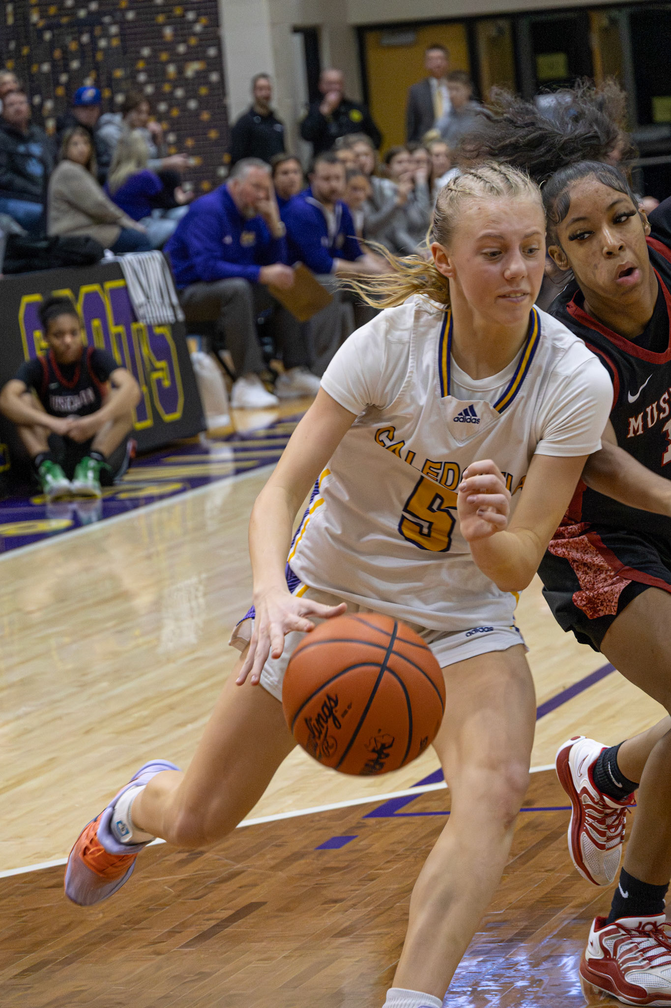 TO THE HOOP Rising Freshman Reese Abbott takes the ball up strong against Muskegon. (Photo by Taya Penoes)