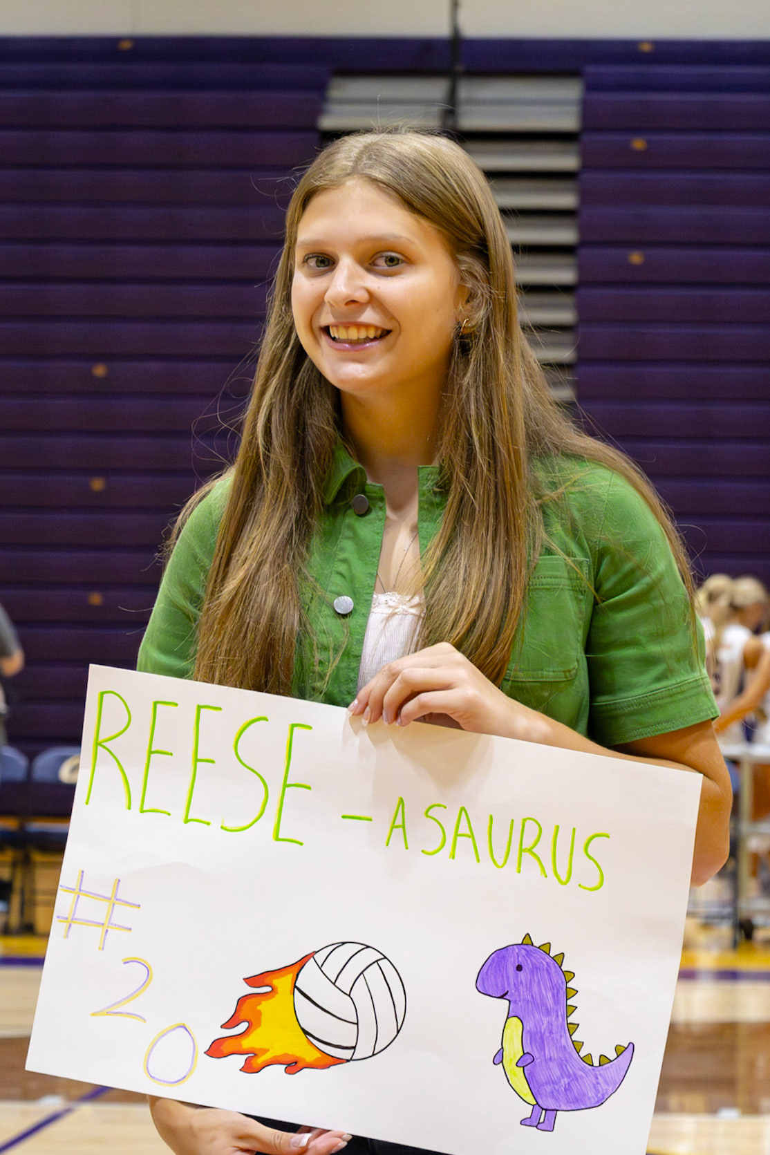 Always showing their support, Caledonia students cheer on their teams. Senior Jolie King makes a poster for a volleyball player. (Photo by Kortney Muller)