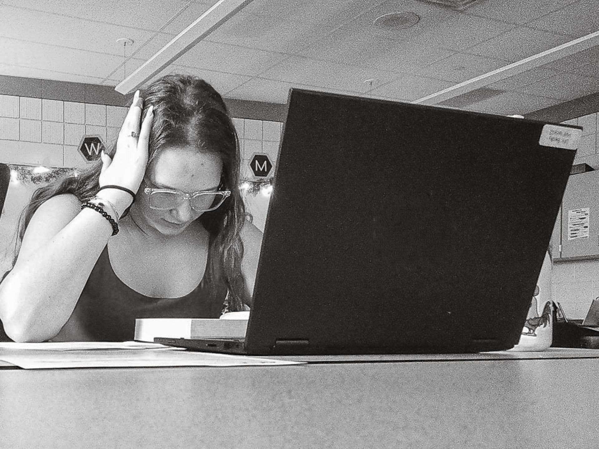 BOOK SMART Becky Pruett stays ahead of the class by diving into her book. (Photo by Kayley Martin)