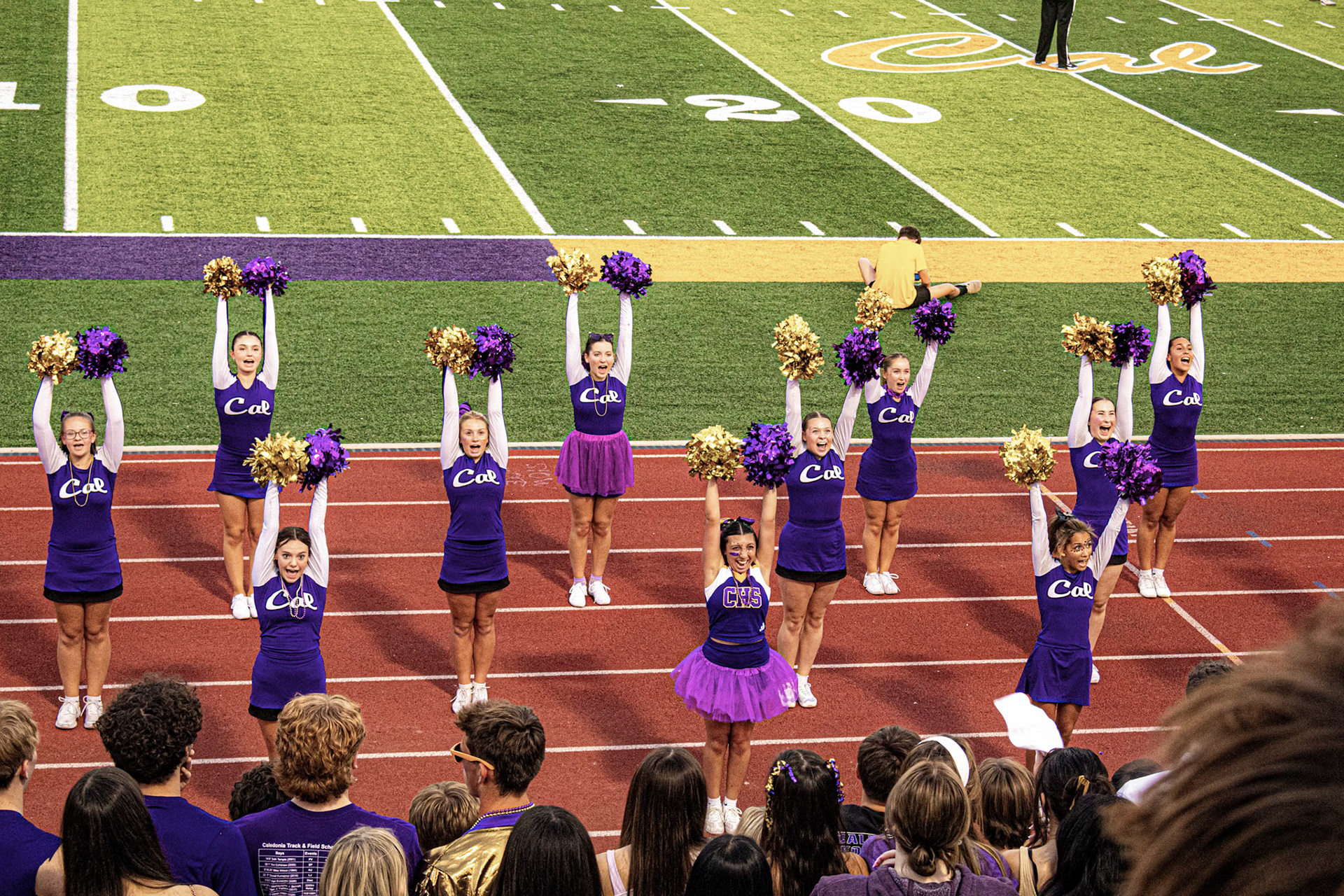 PERFECT UNISON  The JV cheerleaders hype up the crowd to support thier Fighting Scots. (Photo by Joseph Dunn)