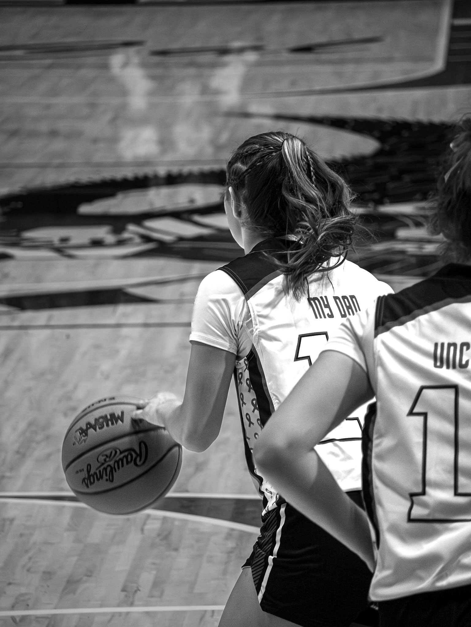 Baylee drives down the court with purpose on her senior night. (Photo by Aibree Akers)
