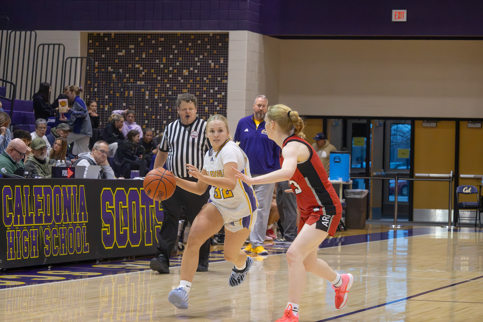Remy Meyer attacks the basket for the scots. (Photo By Landry Mueller)