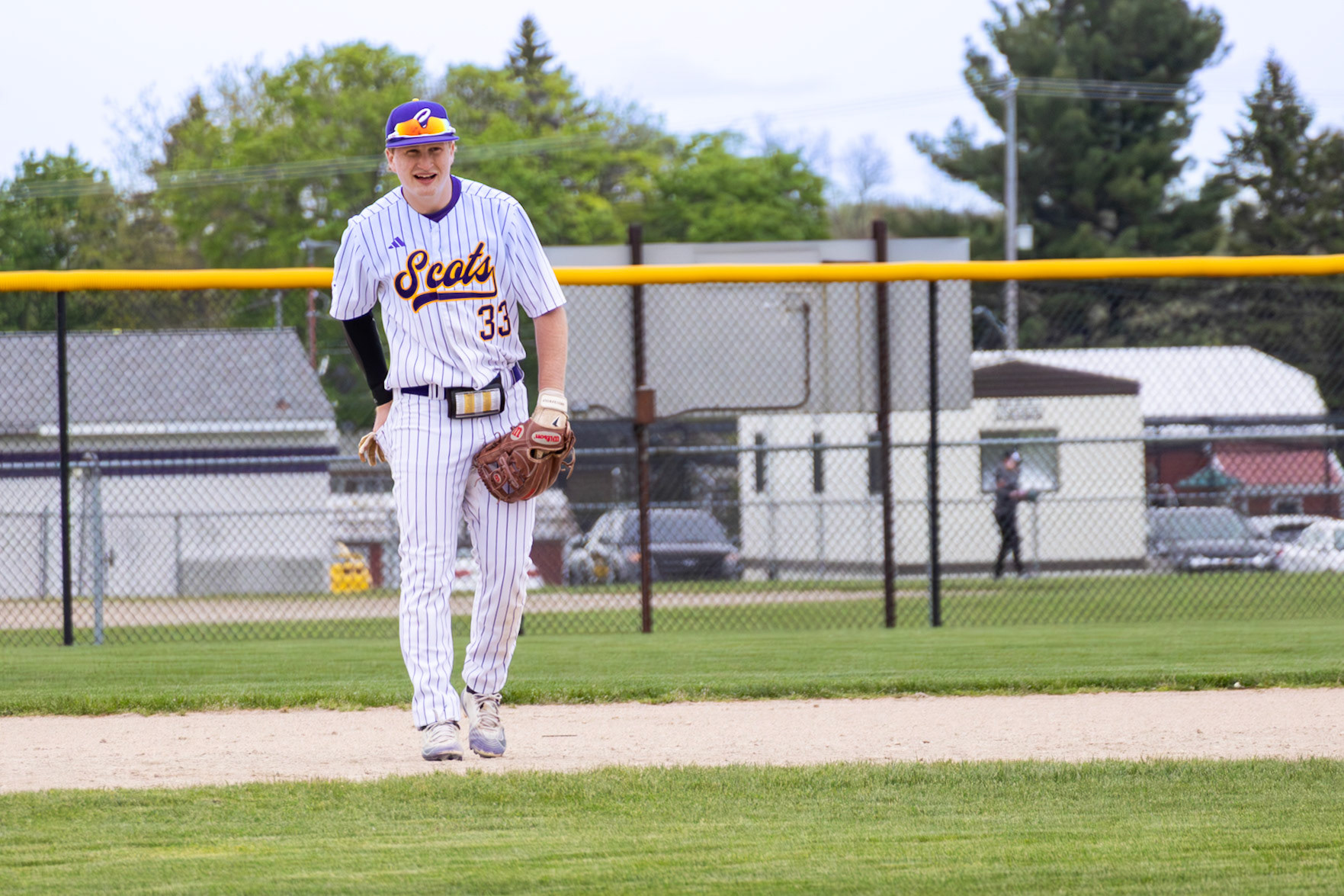 Third baseman Ryne Wysocki returns to position in the field, ready for the next inning against Muskegon. (Photo by Vivian Hoffman)